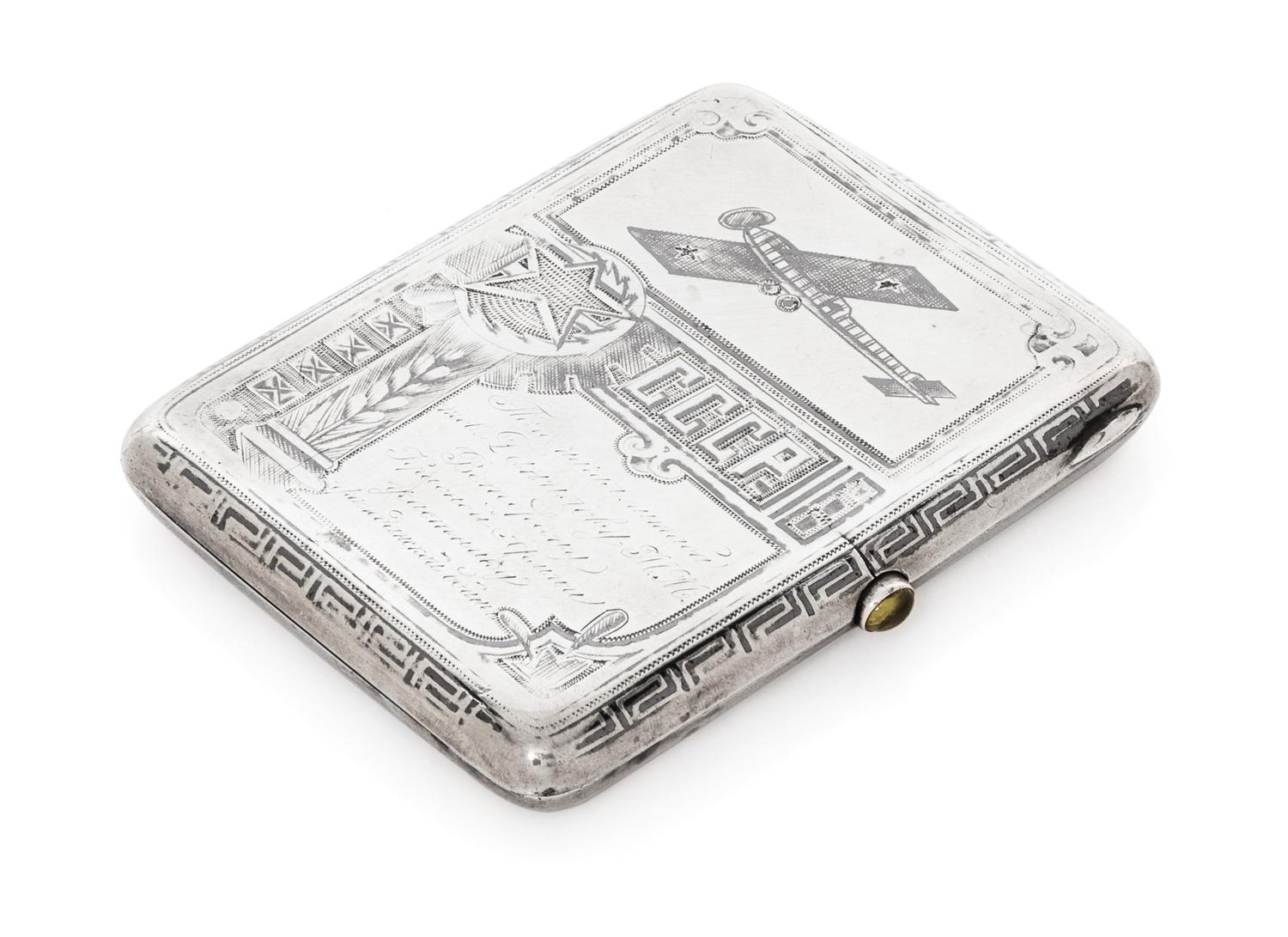 A Russian Niello Silver Cigarette Case, Maker's Mark Obscured, Moscow, Early 20th Century, the case decorated with airplanes and symbol