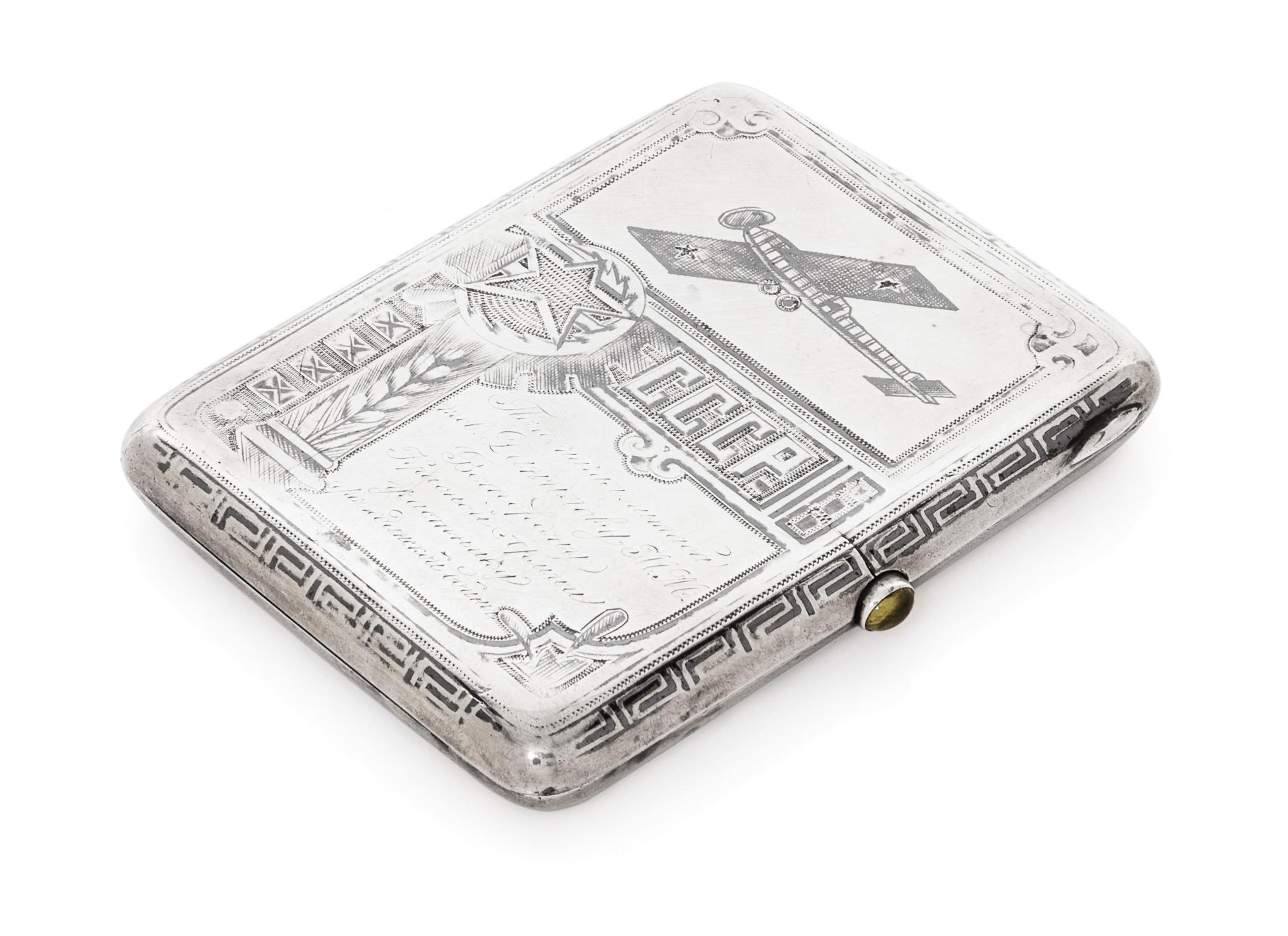 A Russian Niello Silver Cigarette Case, Maker's Mark Obscured, Moscow, Early 20th Century, the case decorated with airplanes and symbol