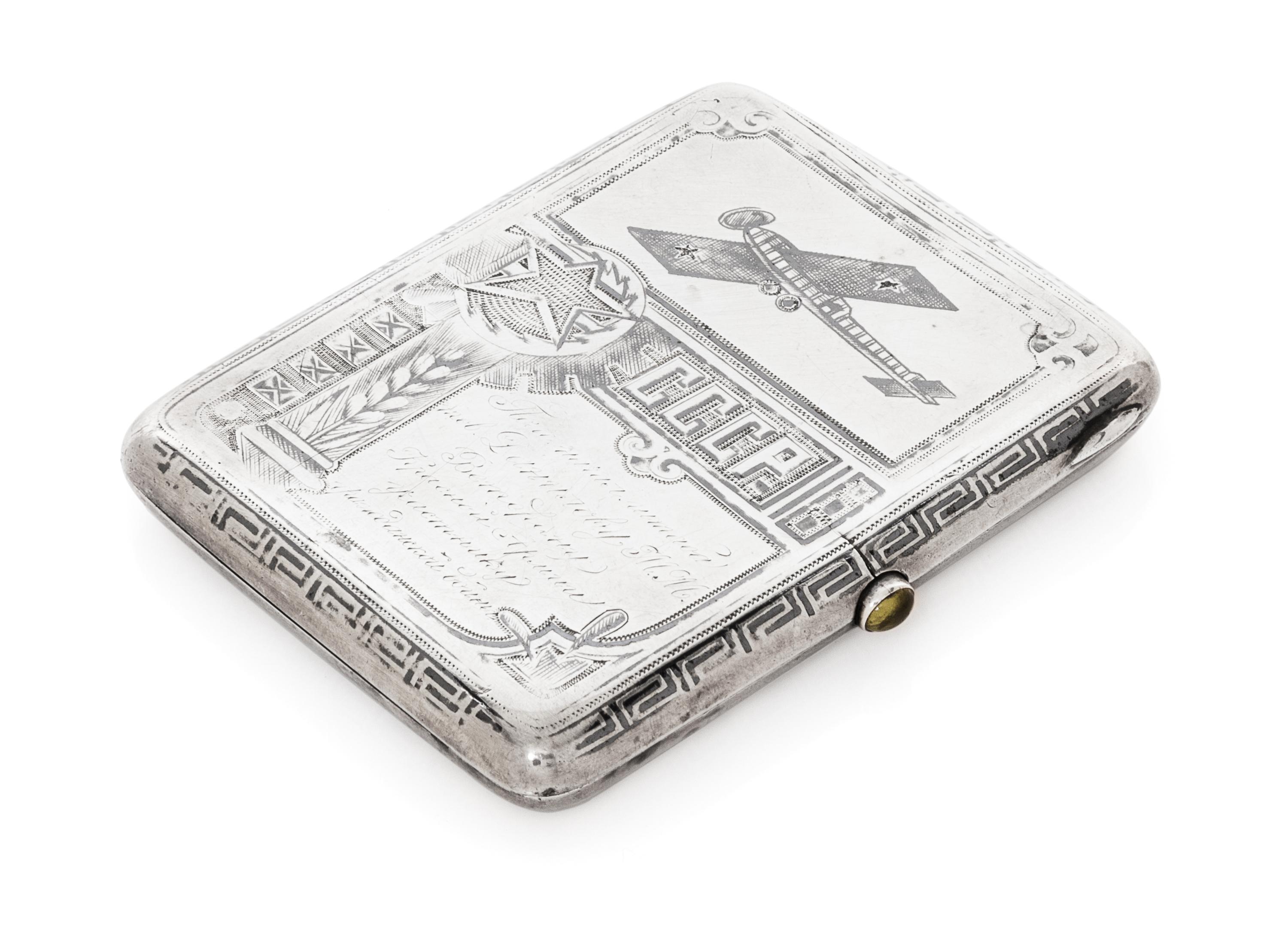 A Russian Niello Silver Cigarette Case, Maker's Mark Obscured, Moscow, Early 20th Century, the case decorated with airplanes and symbol