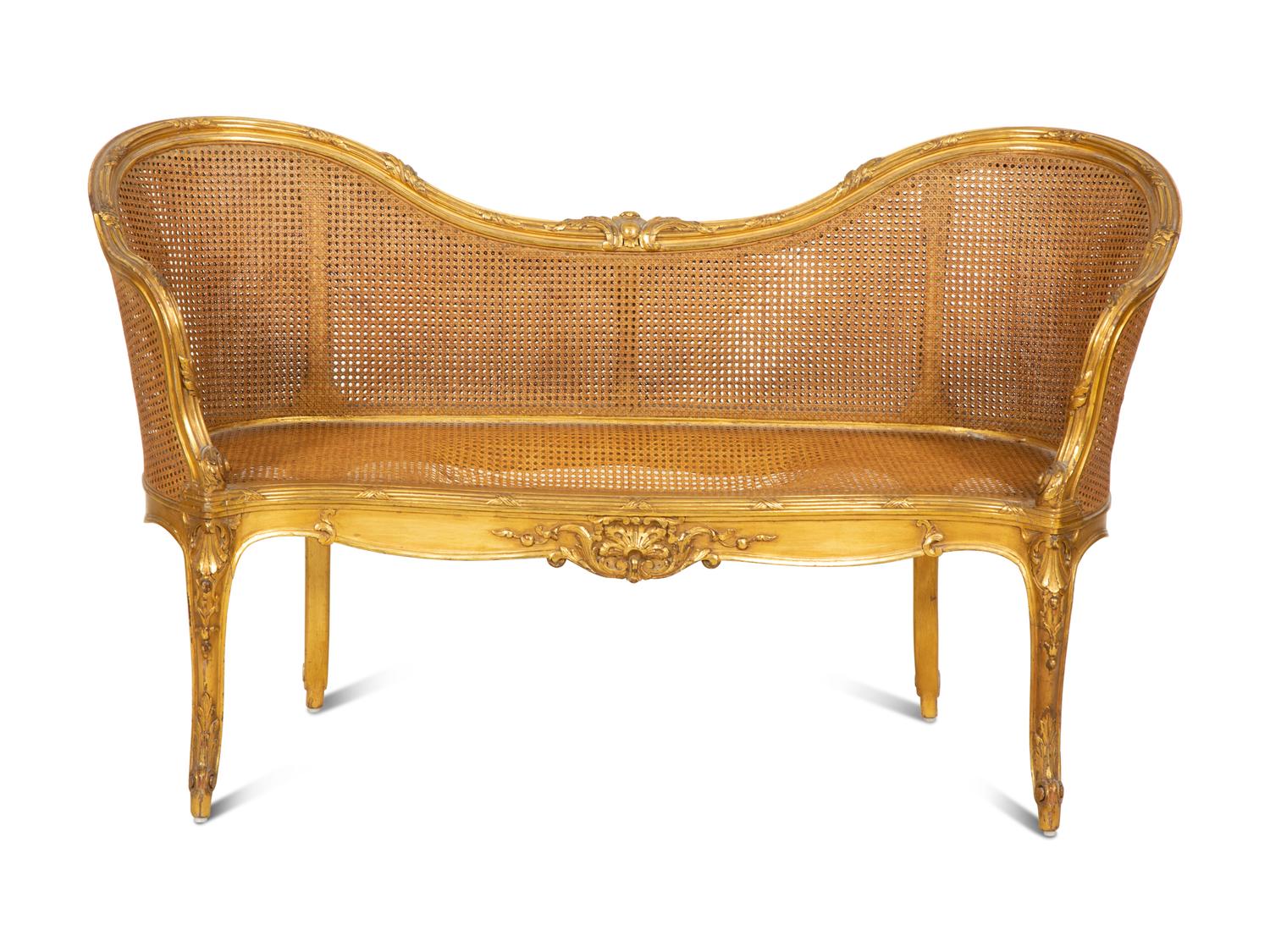 A Louis XV Style Caned Giltwood Settee