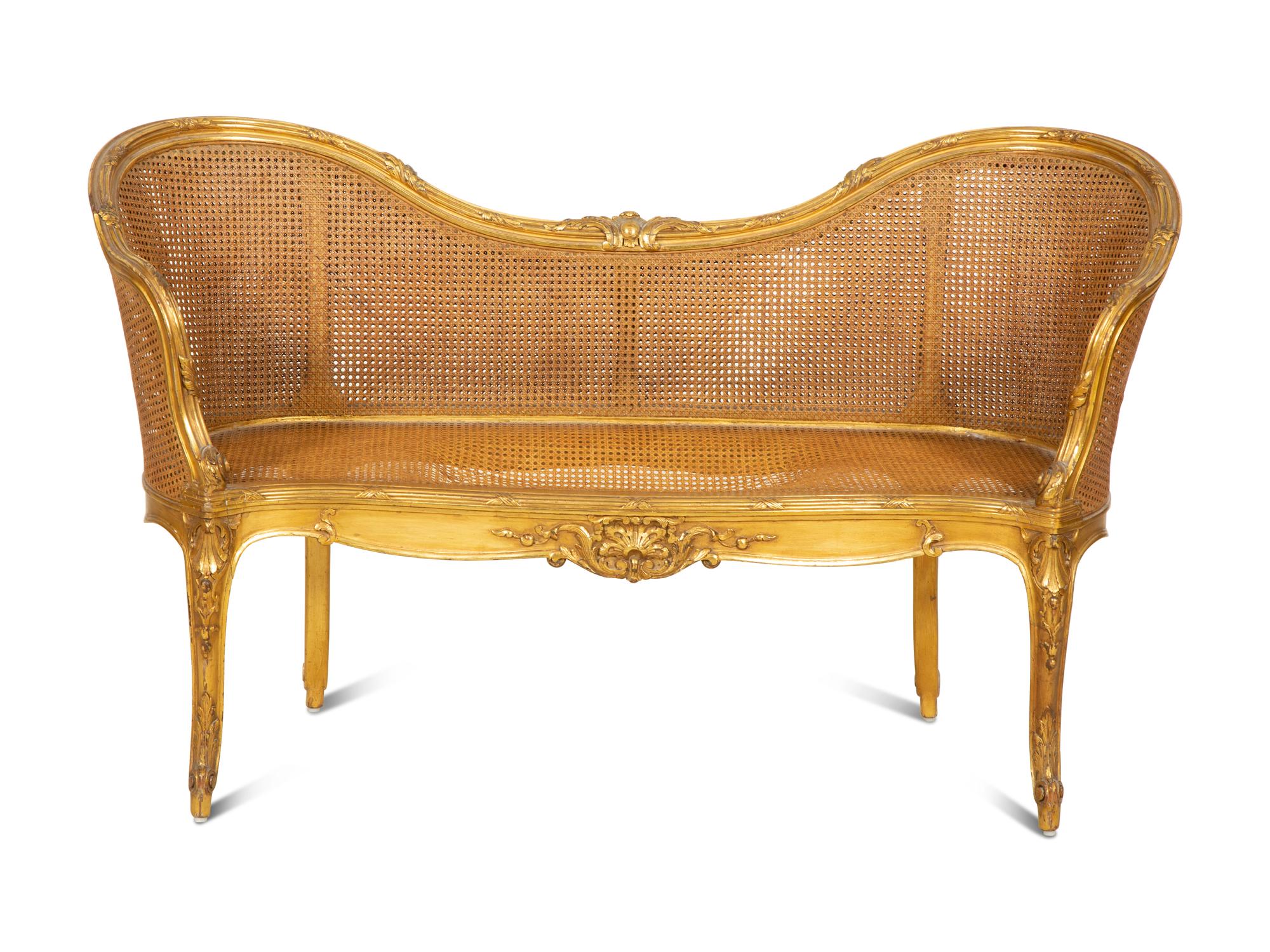 A Louis XV Style Caned Giltwood Settee
