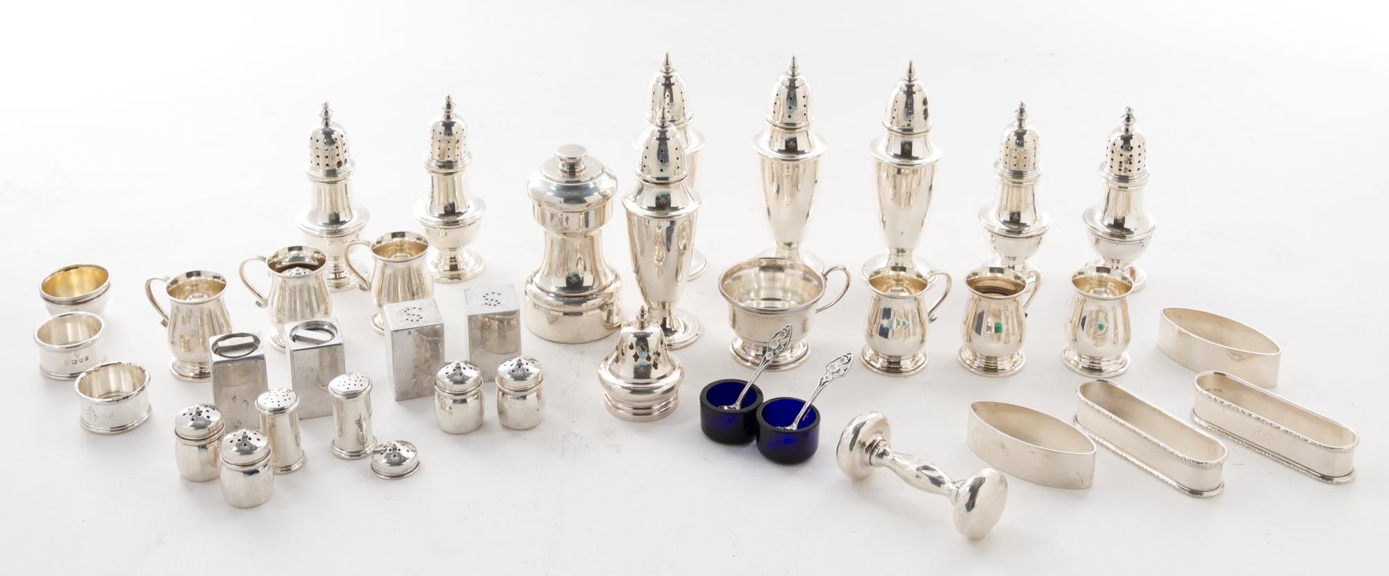 A Collection of American and English Silver Table Articles, of various makers, comprising 16 castors, 4 open salts, a rattle, 4 napkin