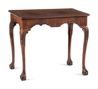 A Queen Anne Shell-Carved and Veneered Walnut Dish-Top Claw-and-Ball Foot Tea Table