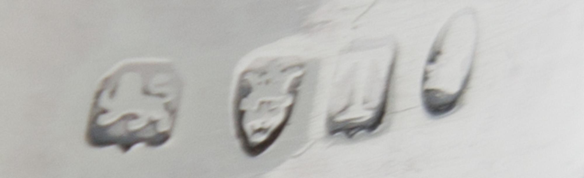 A George III Silver Creamer, Maker's Mark Obscured, London, 1814, the lower half of the body with ribbed decoration.