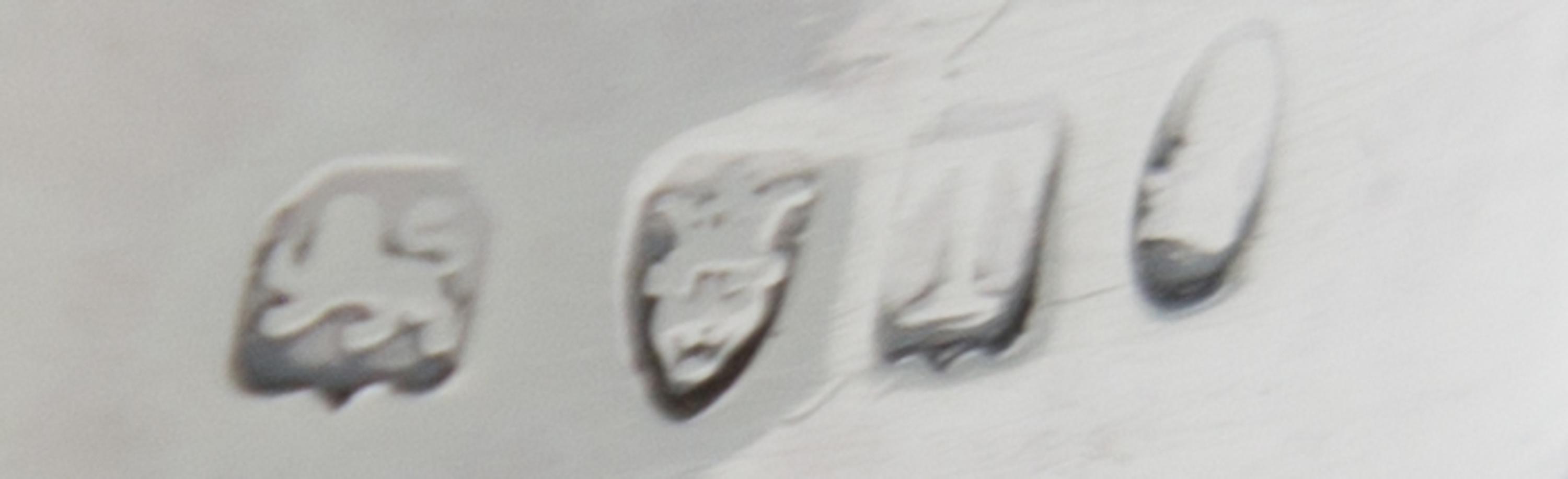 A George III Silver Creamer, Maker's Mark Obscured, London, 1814, the lower half of the body with ribbed decoration.
