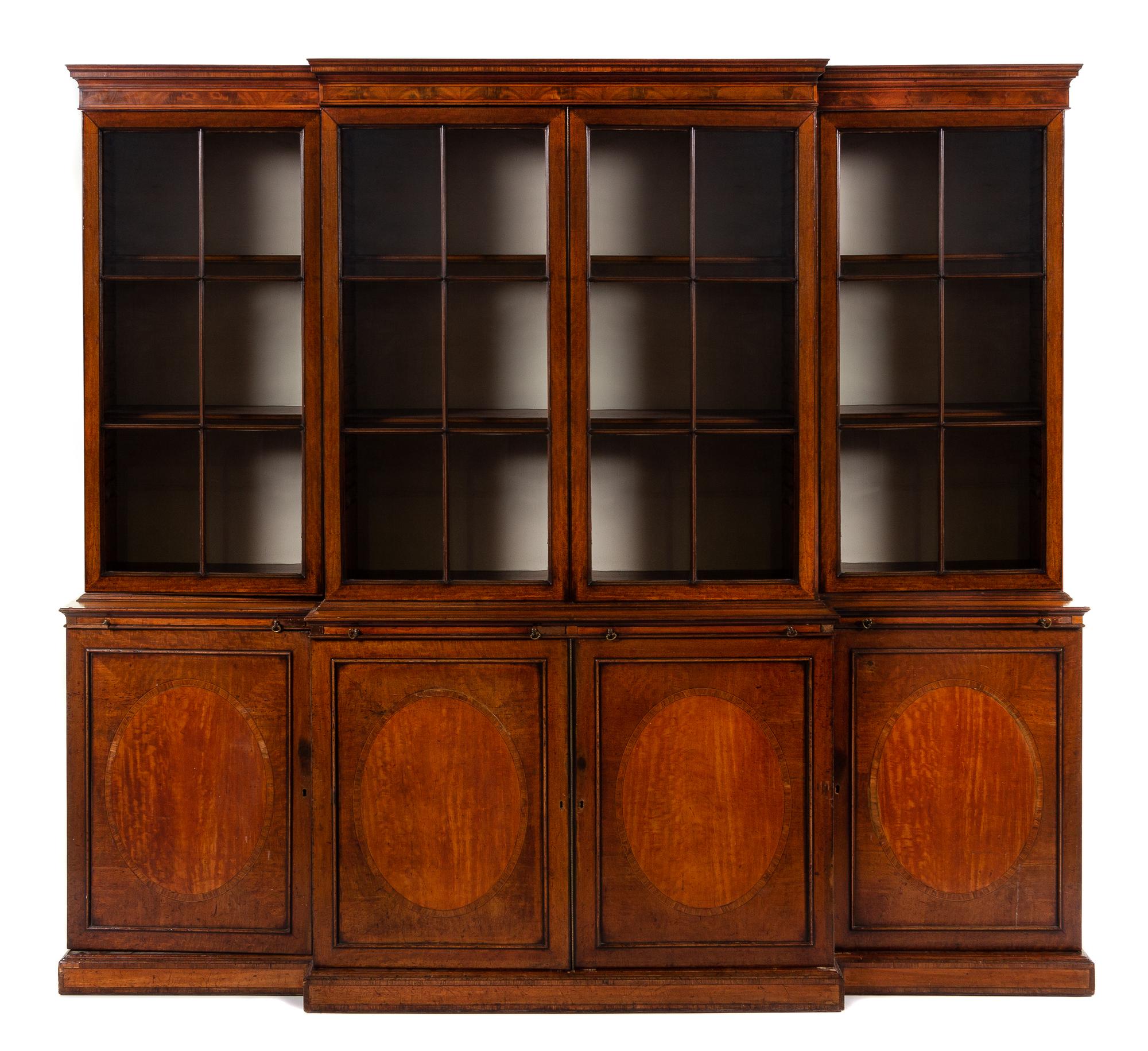An English Mahogany Breakfront Bookcase Height 94 x width 103 x depth 23 1/3 inches. — 19TH CENTURY