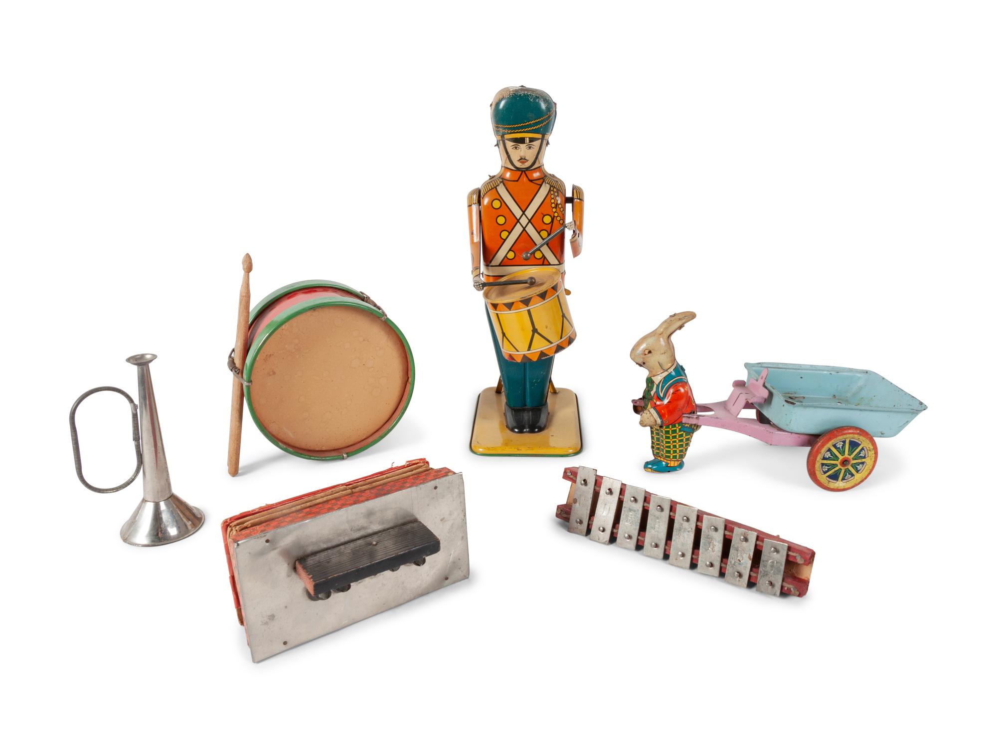 A Group of Children's Musical Instrument Toys and Tin Lithographed Mechanical Objects