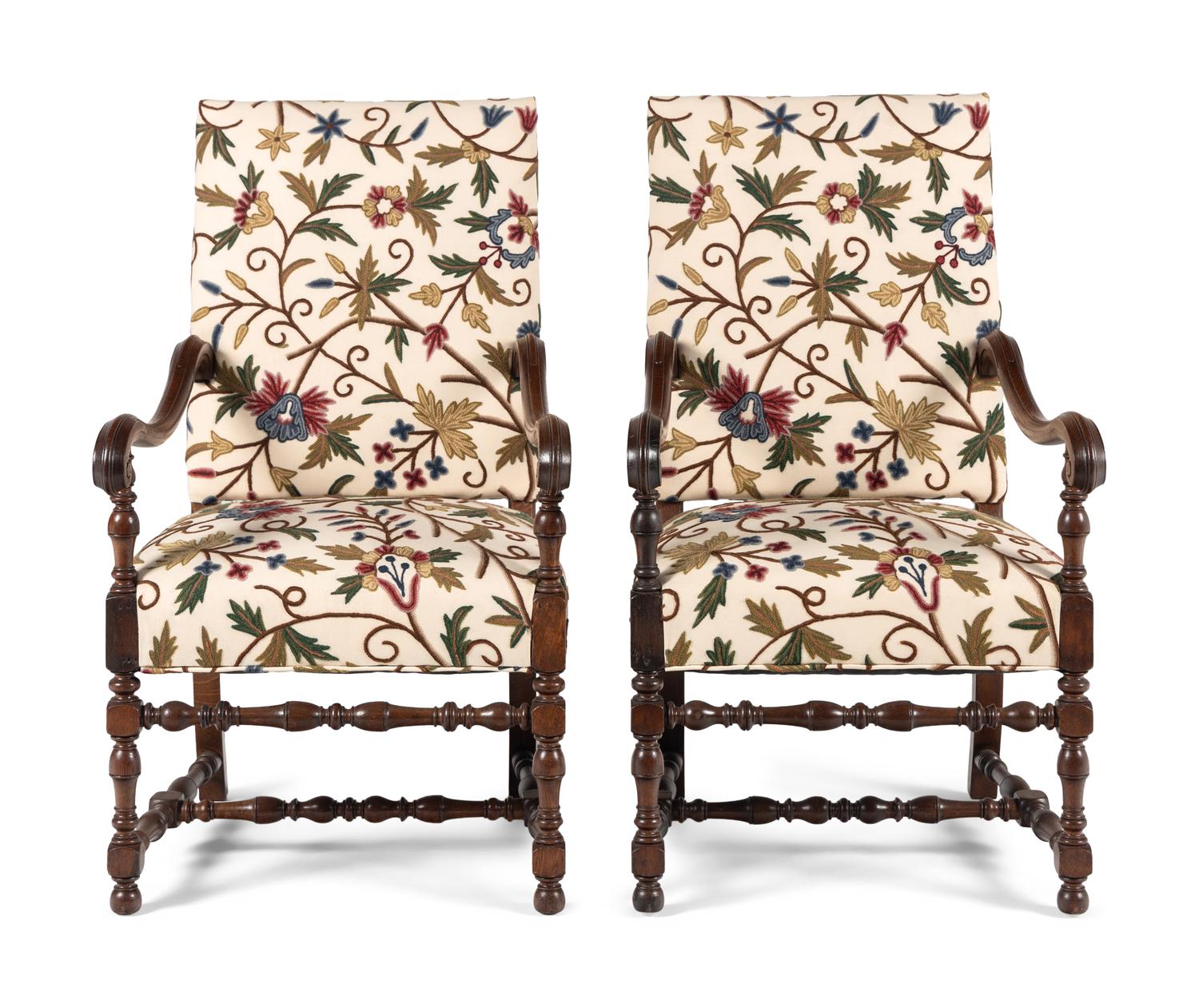 A Pair of William and Mary Style Walnut Armchairs with Crewelwork Upholstery