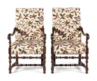 A Pair of William and Mary Style Walnut Armchairs with Crewelwork Upholstery