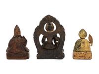 Three Sino-Tibetan Carved Wood Seated Figures