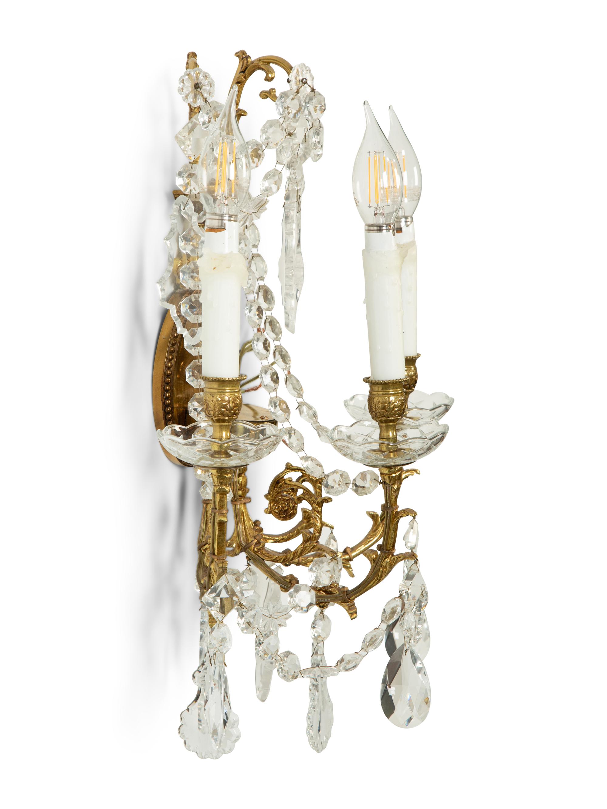 A Pair of Gilt Metal and Cut Glass Three-Light Wall Lights