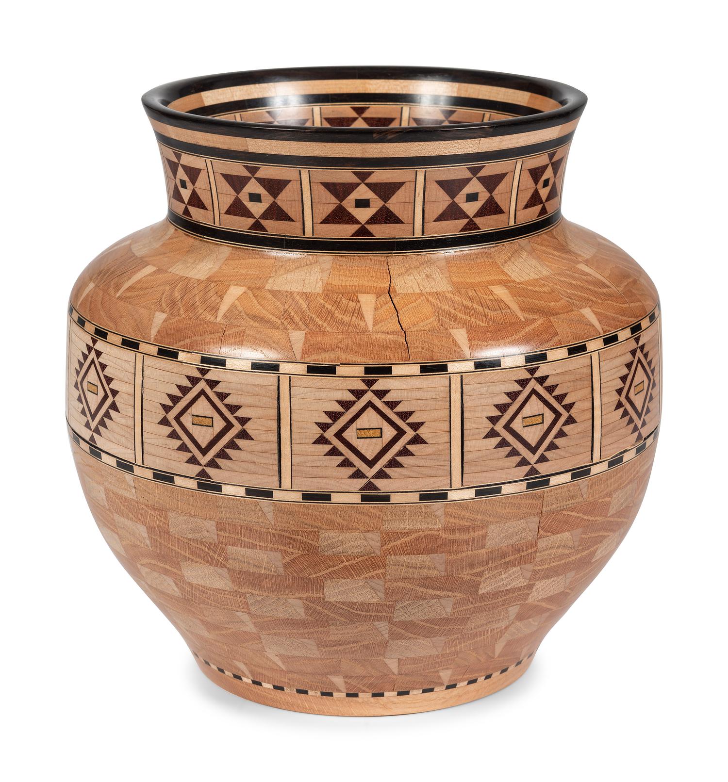 A Turned and Segmented Wood Vase in the style of Ray Allen