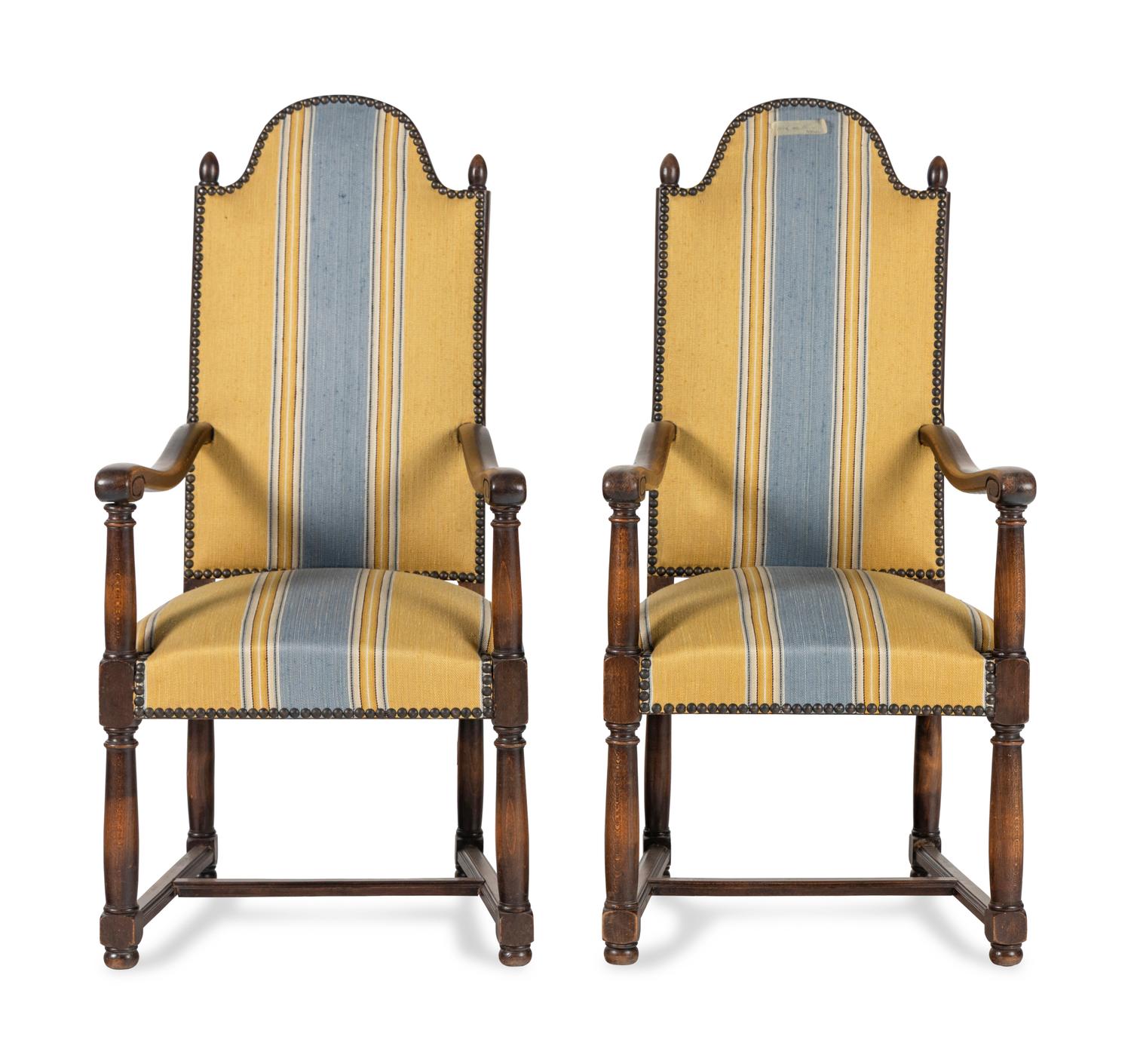 A Pair of French Provincial Carved Oak Fauteuils