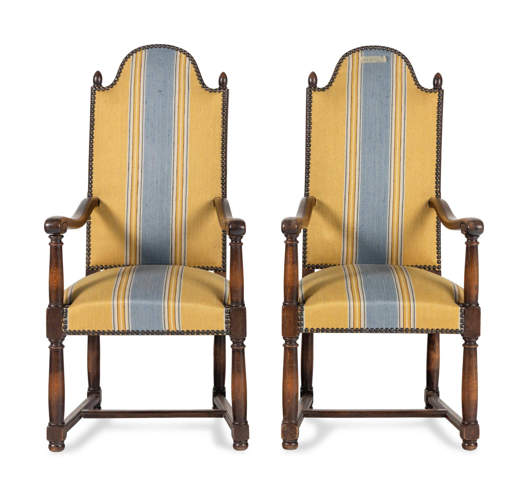 A Pair of French Provincial Carved Oak Fauteuils
