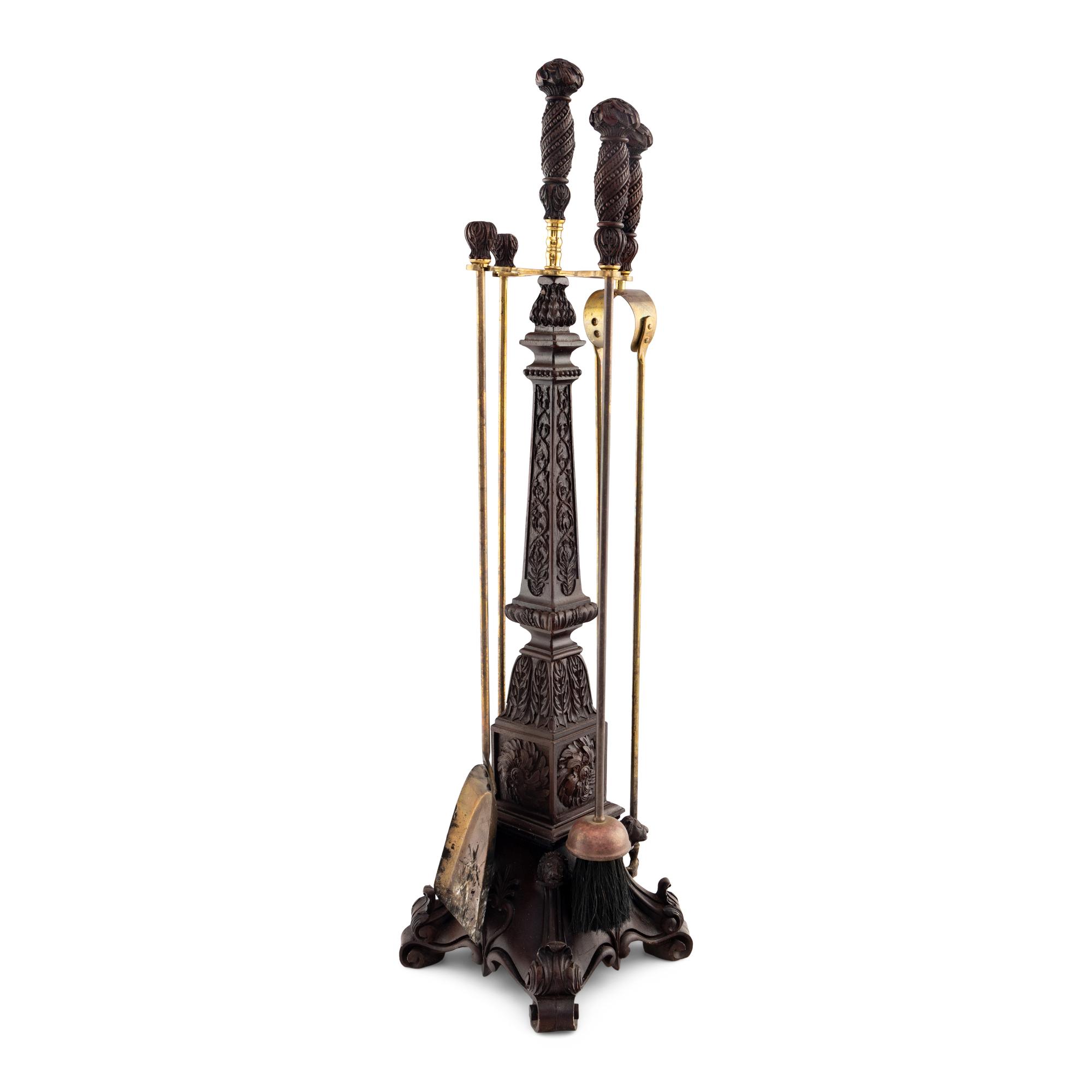 A Set of Swiss "Black Forest" Carved Fireplace Tools