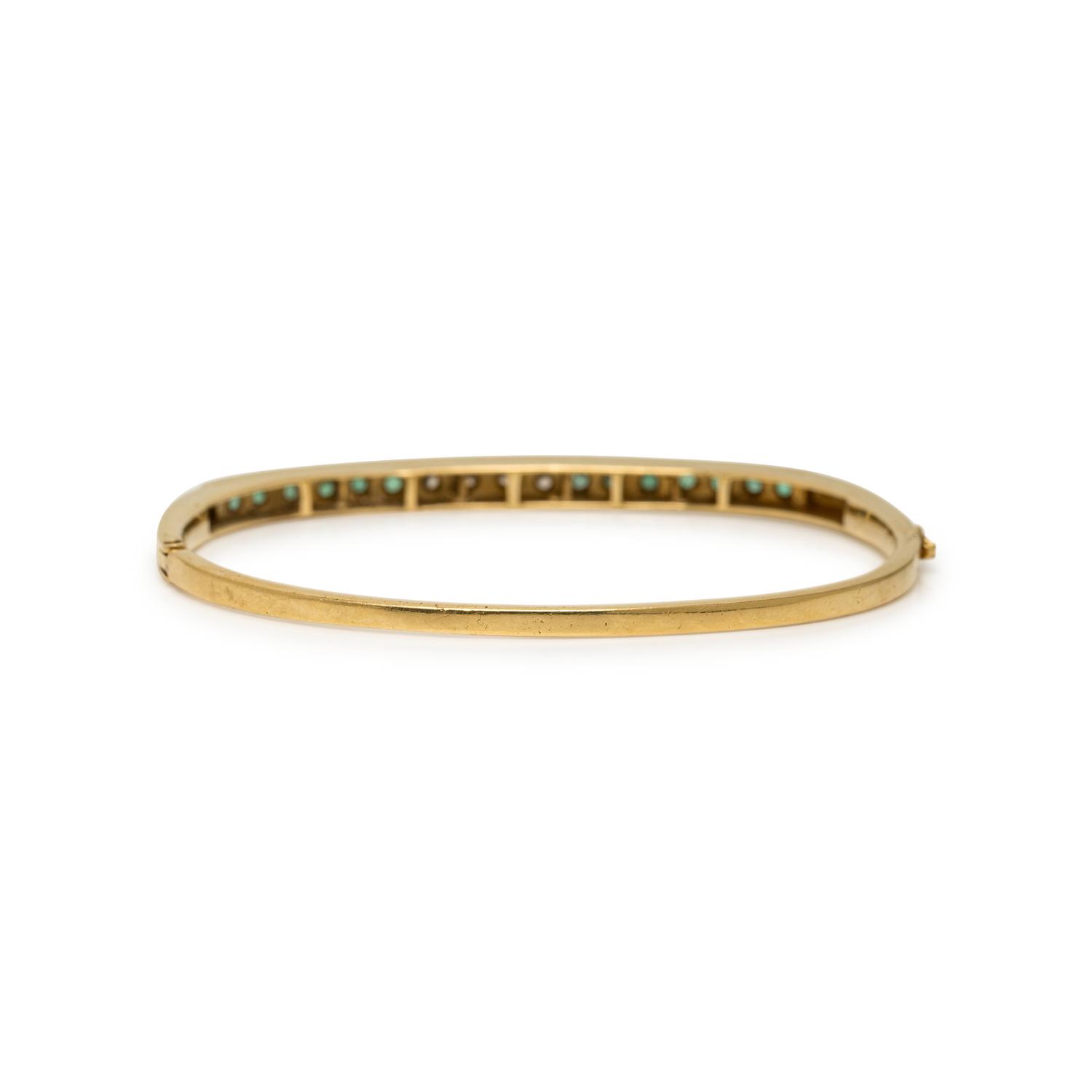 YELLOW GOLD, DIAMOND, AND EMERALD BANGLE BRACELET