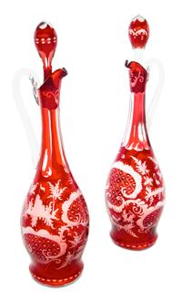 A Pair of Bohemian Red Cut to Clear Glass Decanters Height 14 1/4 inches.