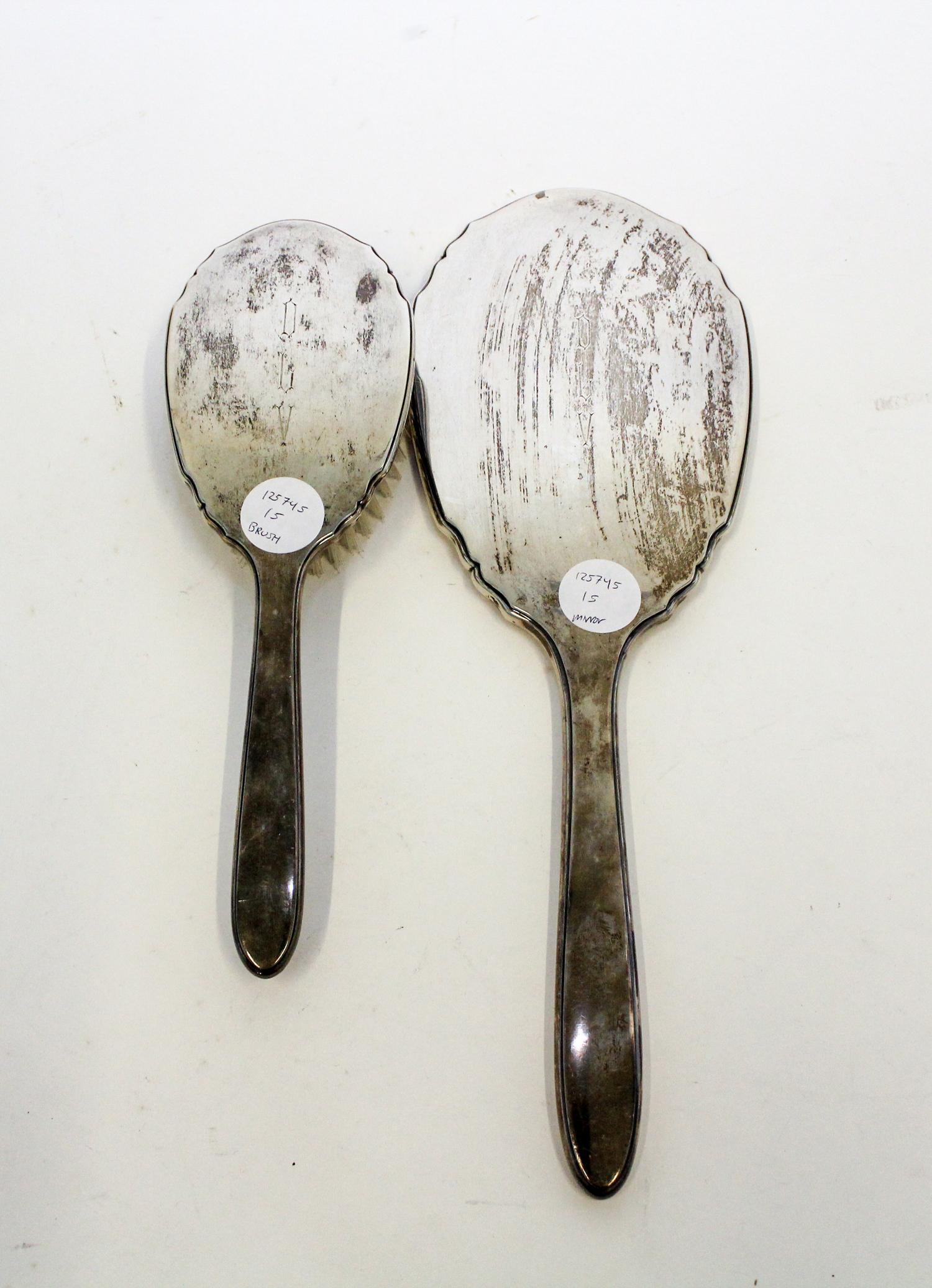 A Collection of American Silver Objects, various makers, comprising an International Sterling two-piece dresser set, two silver belt-bu