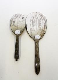 A Collection of American Silver Objects, various makers, comprising an International Sterling two-piece dresser set, two silver belt-bu