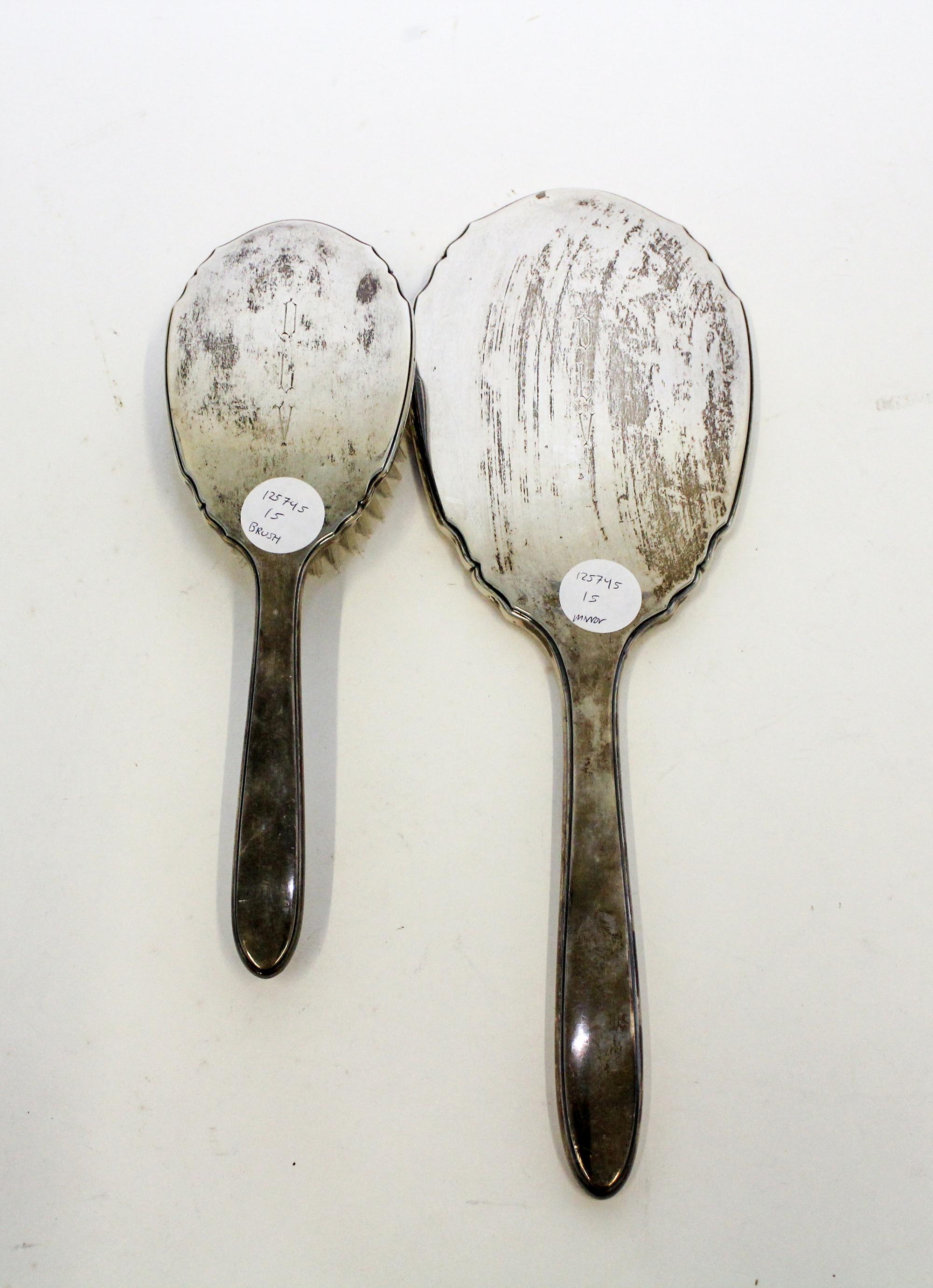 A Collection of American Silver Objects, various makers, comprising an International Sterling two-piece dresser set, two silver belt-bu