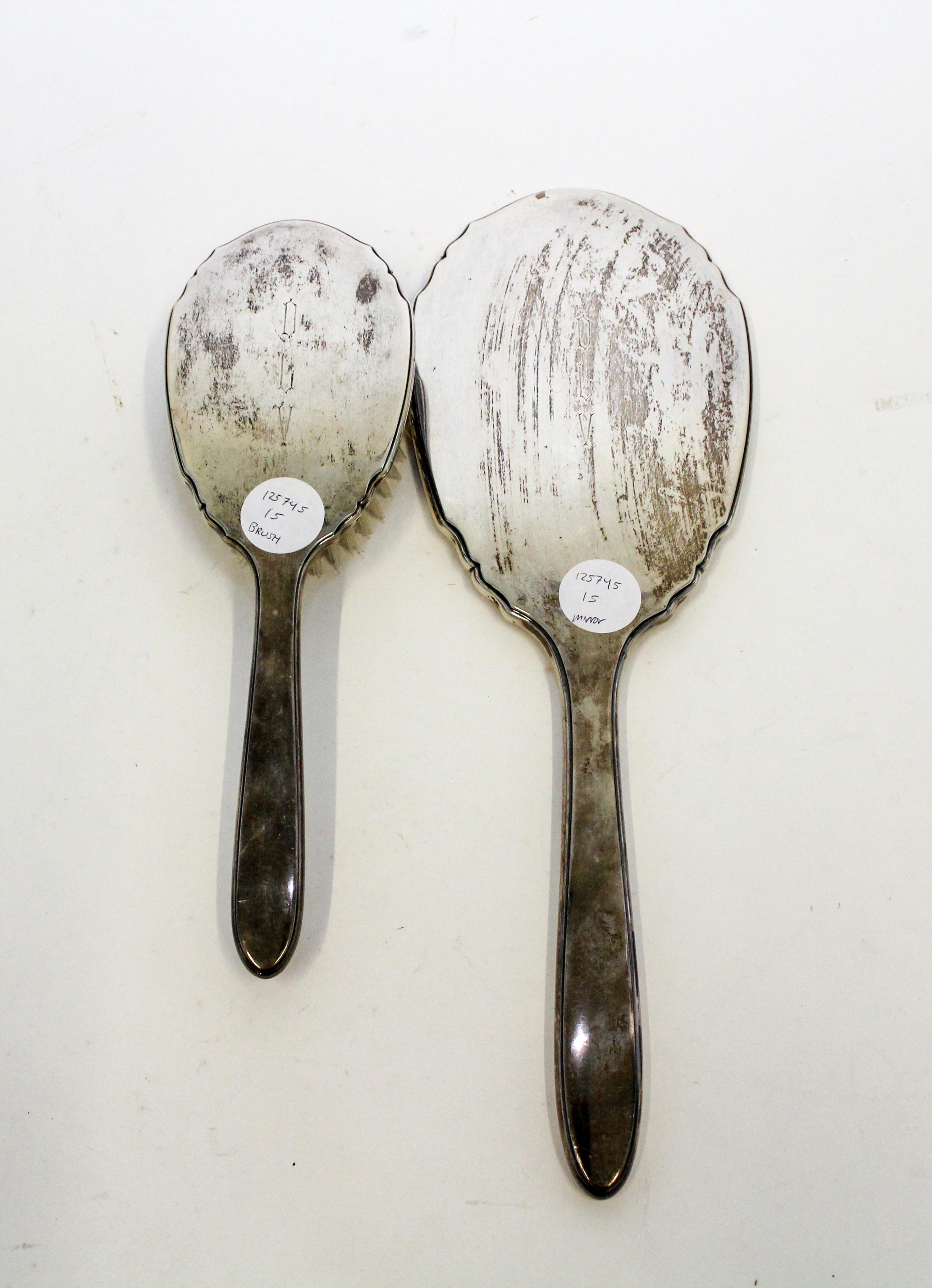 A Collection of American Silver Objects, various makers, comprising an International Sterling two-piece dresser set, two silver belt-bu