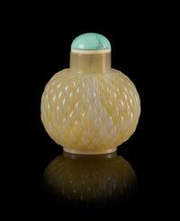 A Carved Agate Snuff Bottle Height 2 inches.
