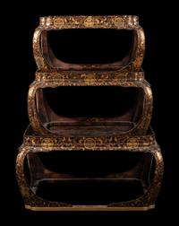 A Set of Three Japanese Gilt Decorated Lacquer Nesting Tables