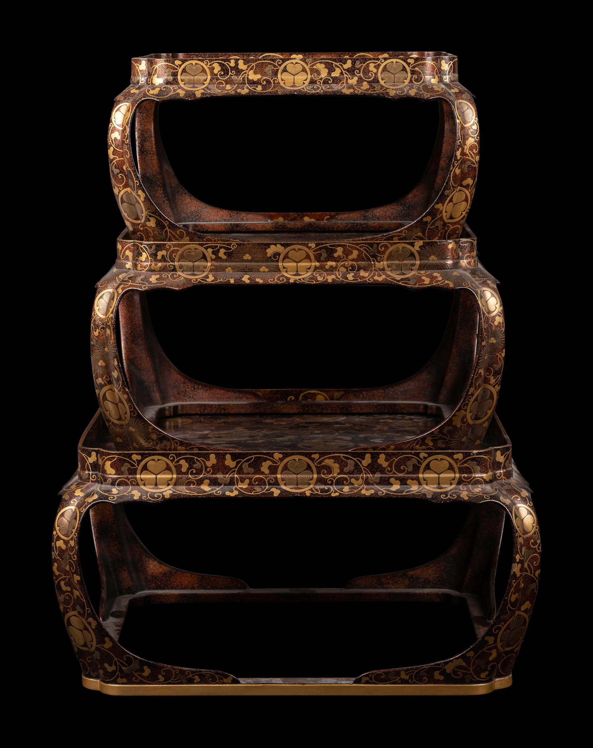 A Set of Three Japanese Gilt Decorated Lacquer Nesting Tables