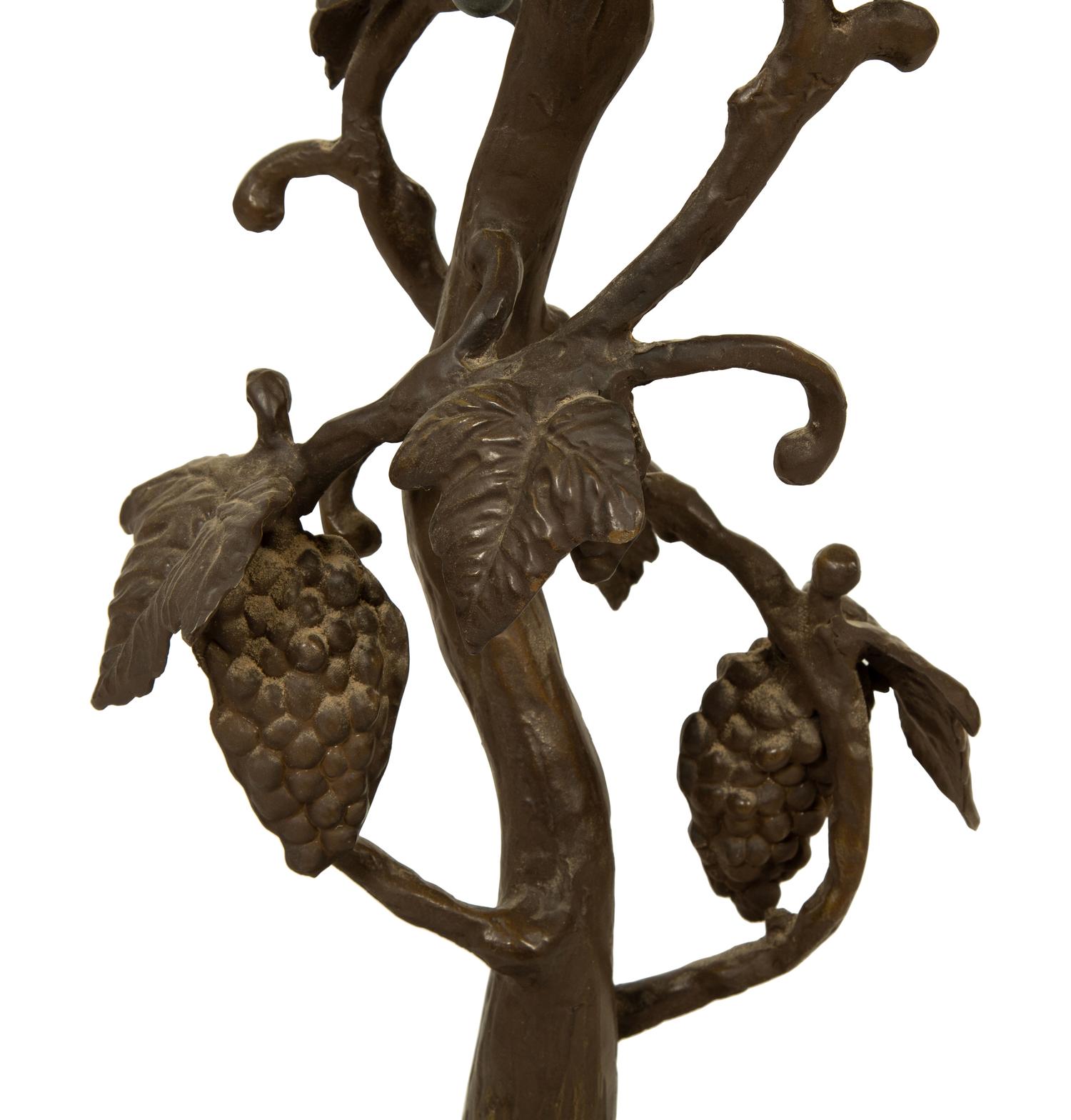 A Leaded Glass and Cast Metal Table Lamp