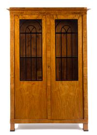 A Biedermeier Parcel Ebonized Burlwood Armoire Height 77 1/4 x width 53 x depth 19 inches. — SECOND QUARTER 19TH CENTURY