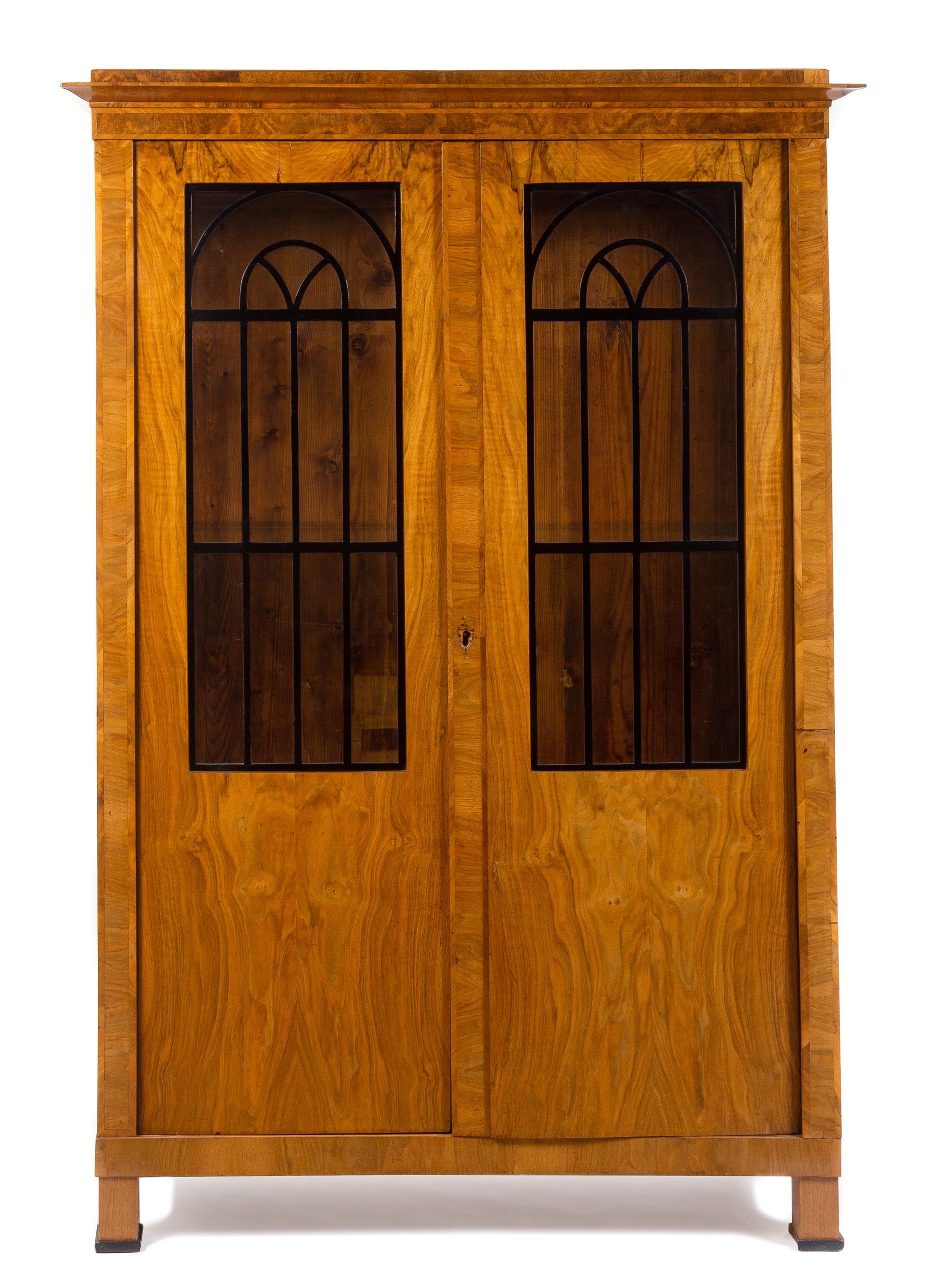 A Biedermeier Parcel Ebonized Burlwood Armoire Height 77 1/4 x width 53 x depth 19 inches. — SECOND QUARTER 19TH CENTURY