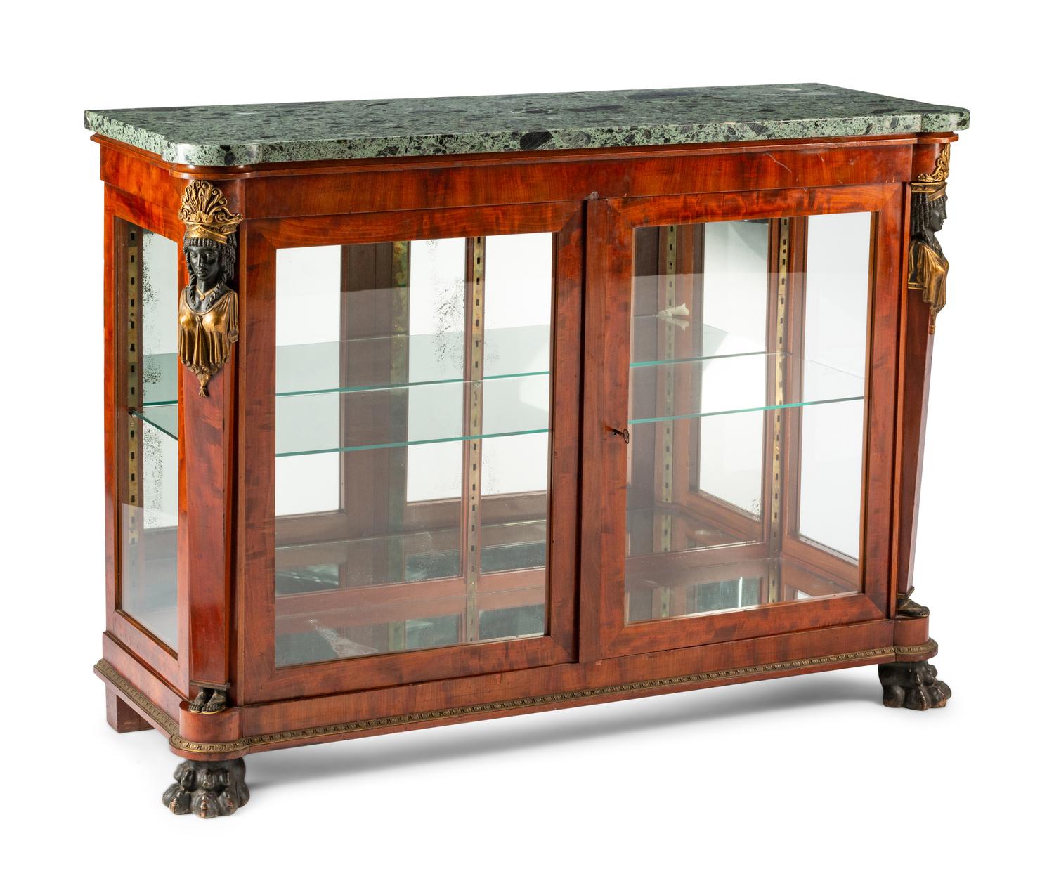 An Empire Egyptian Revival Style Gilt and Patinated Bronze Mounted Mahogany Cabinet