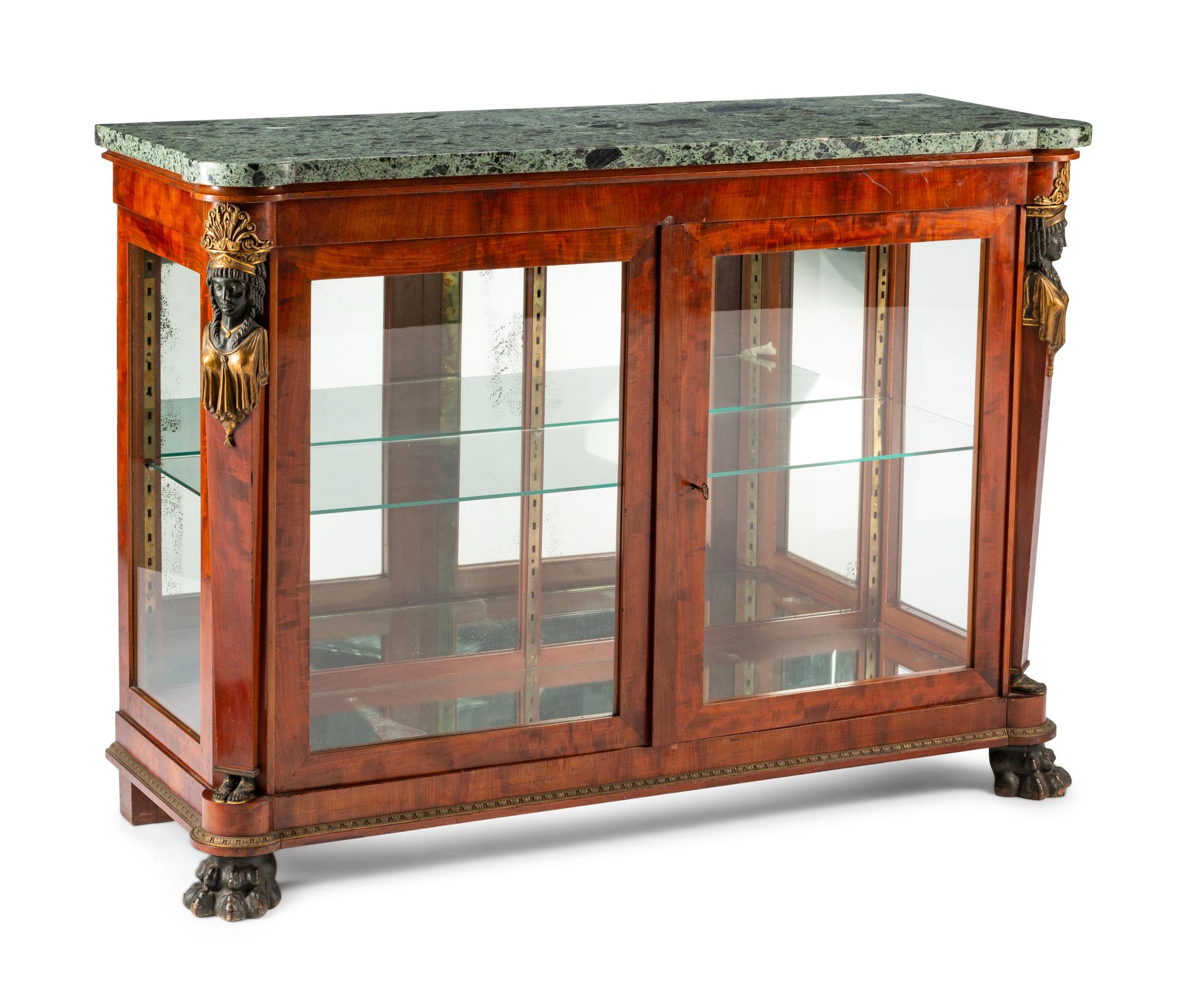 An Empire Egyptian Revival Style Gilt and Patinated Bronze Mounted Mahogany Cabinet