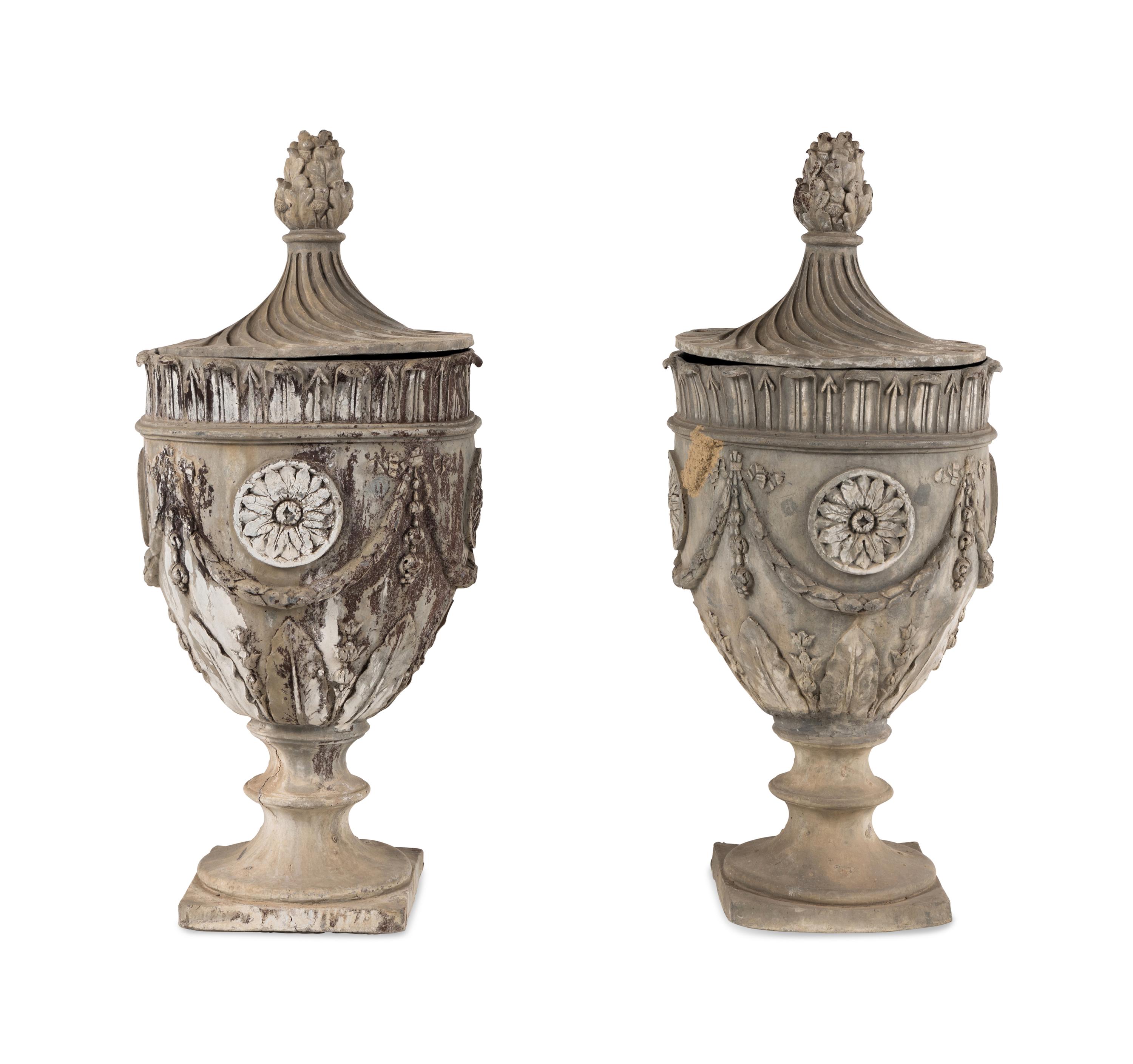 A Pair of Lead Garden Urns and Covers
