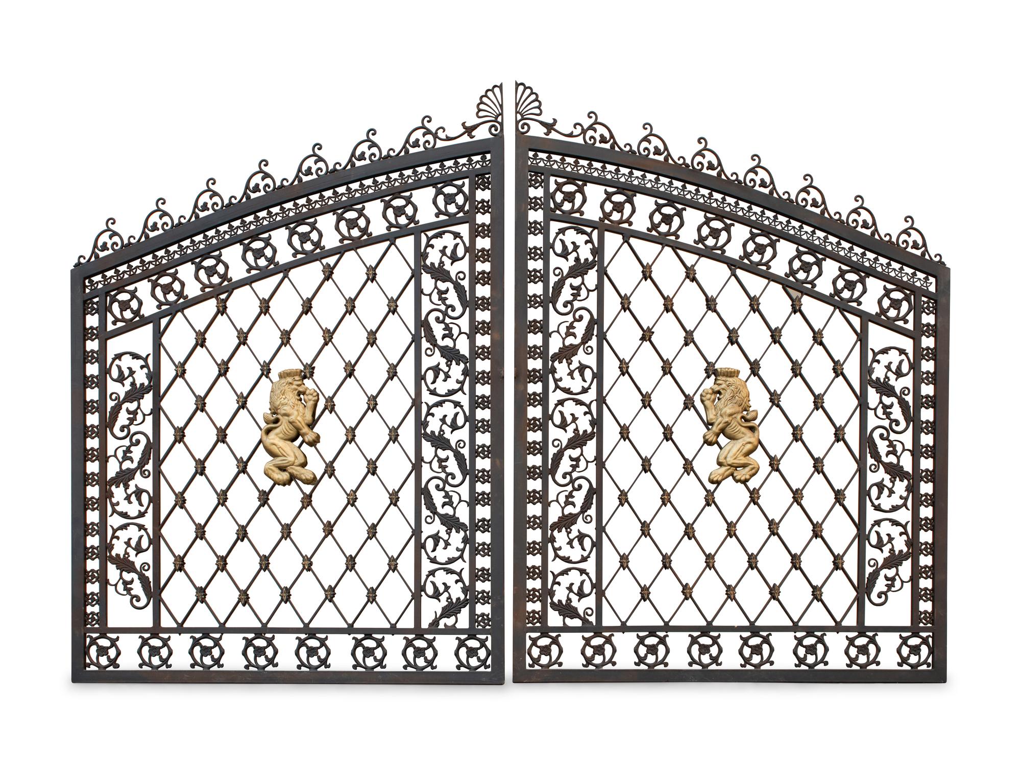 A Pair of Gates with Gilt Rampant Lion Ornaments