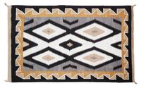 A Navajo Rug 76 x 49 inches. — MID-20TH CENTURY