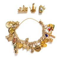 A 14 Karat Yellow Gold Charm Bracelet with 23 Attached Charms, 68.70 dwts.