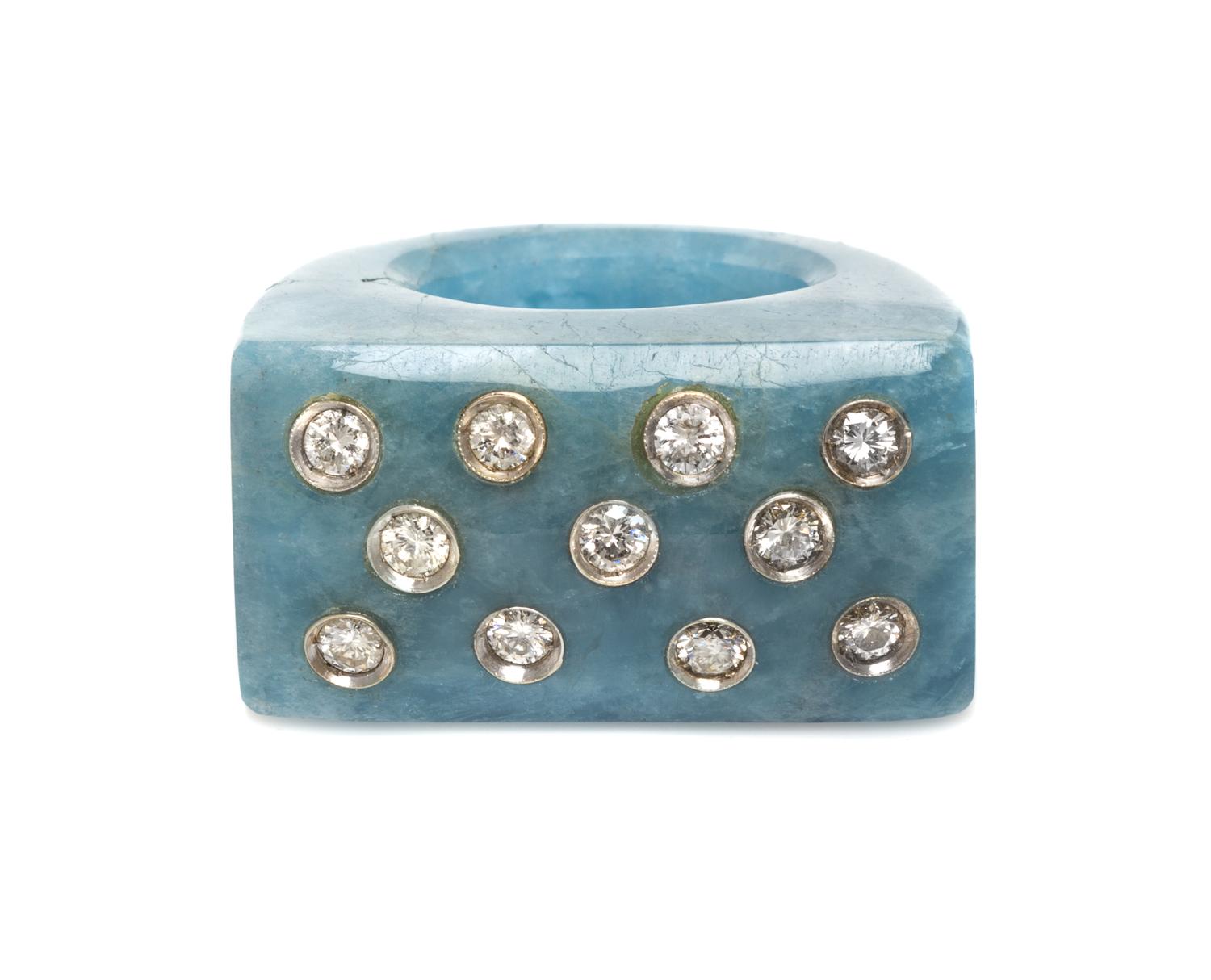 A White Gold, Carved Aquamarine and Diamond Ring, 18.70 dwts.
