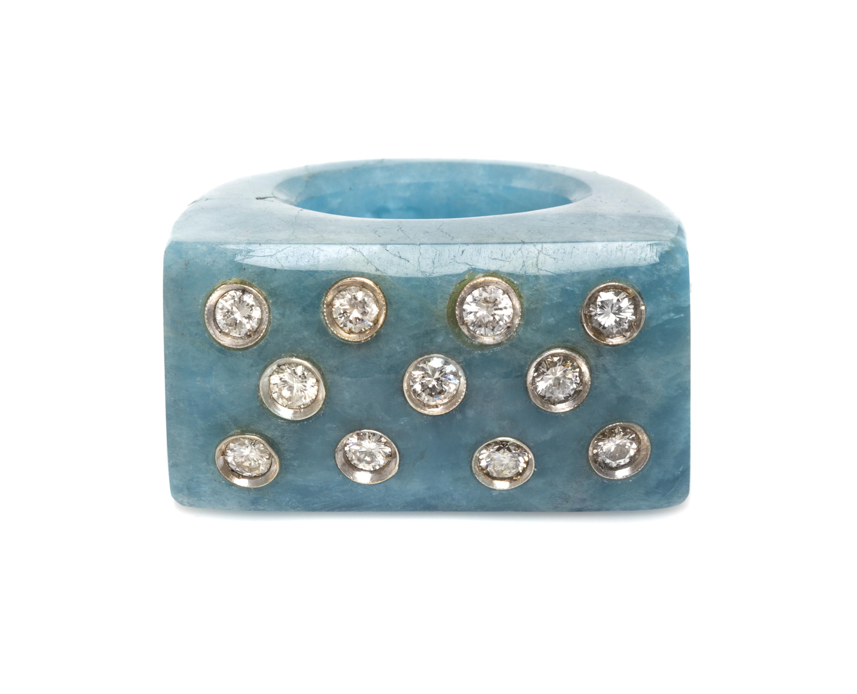 A White Gold, Carved Aquamarine and Diamond Ring, 18.70 dwts.