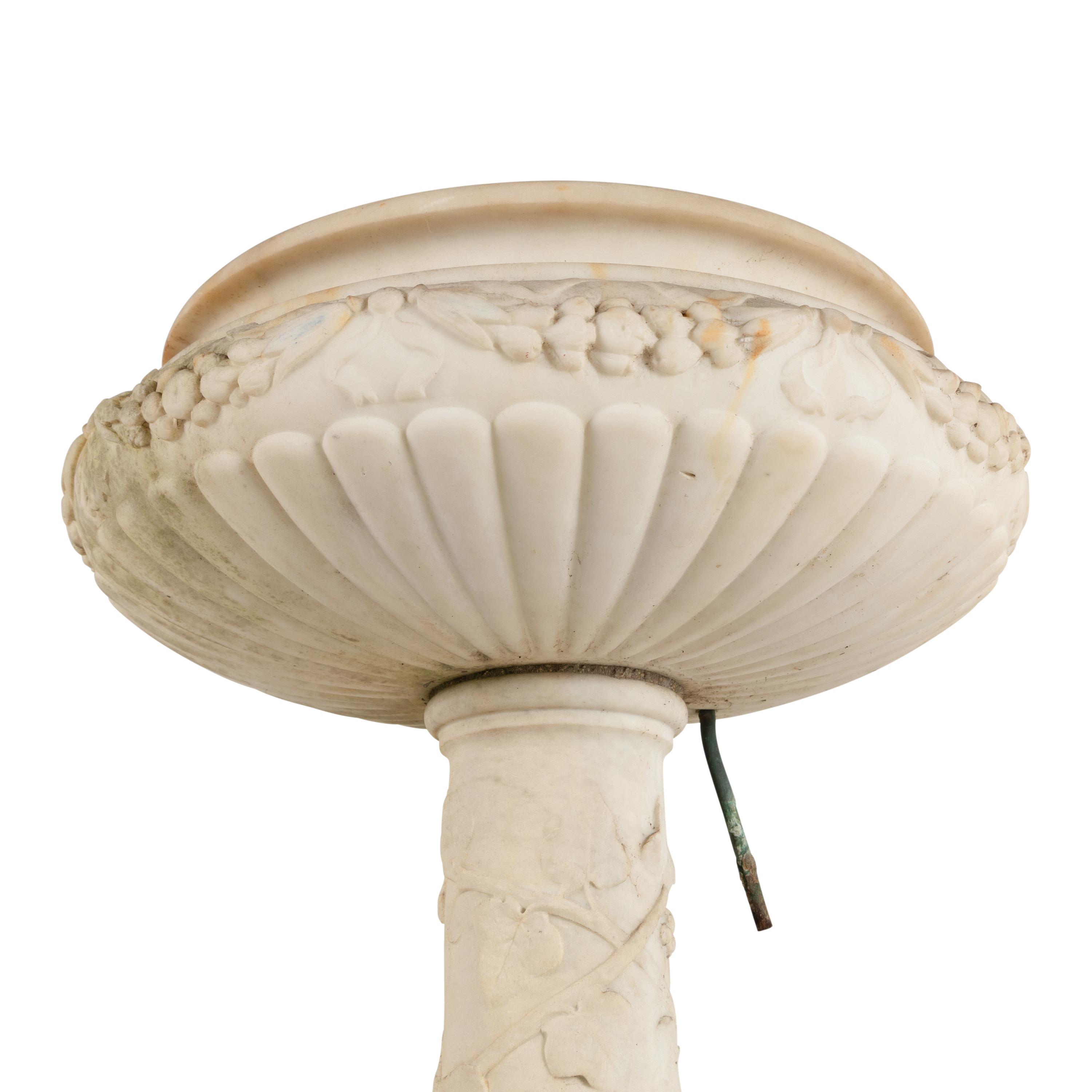A Pair of Carved Marble Jardinières on Pedestals