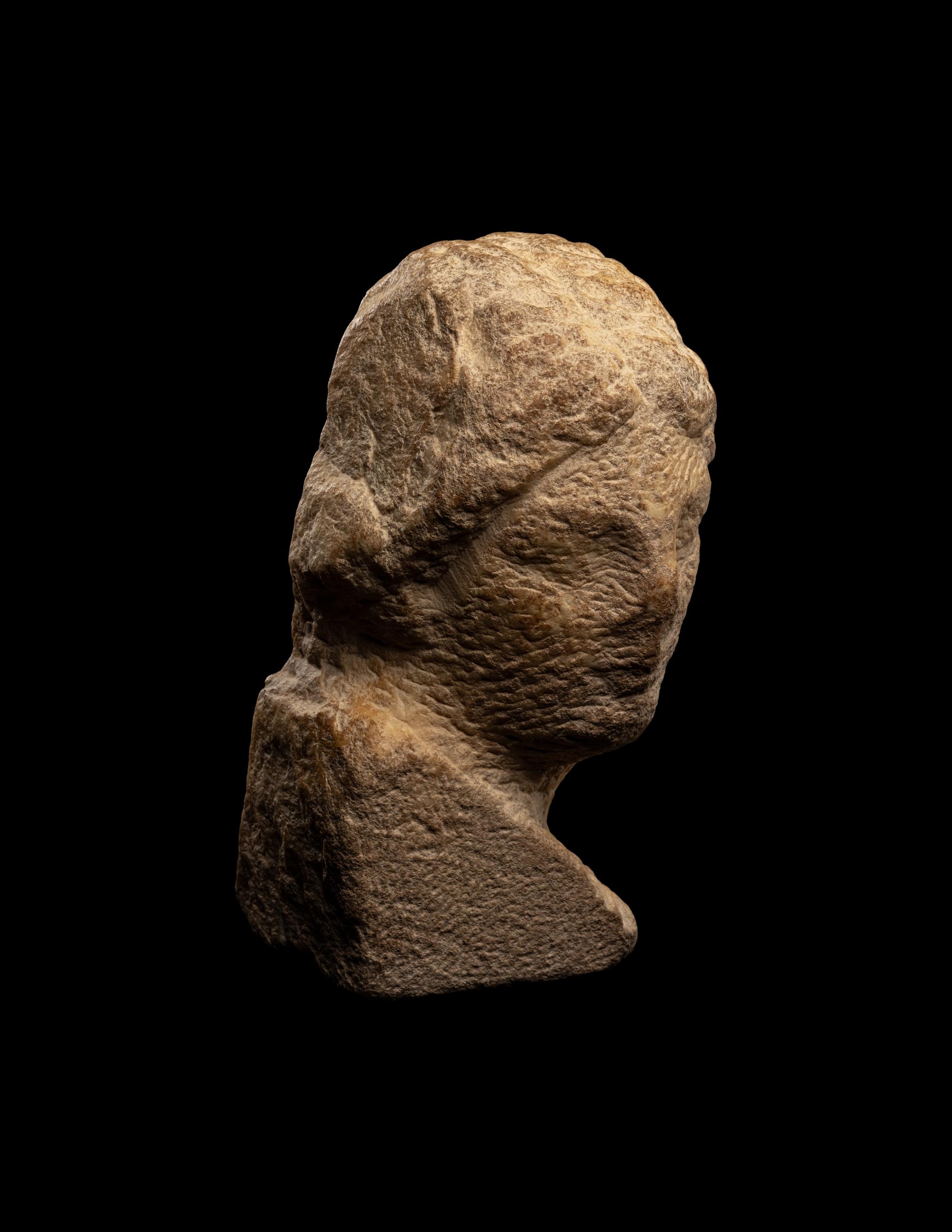 An Unfinished Greek Marble Head of a Woman