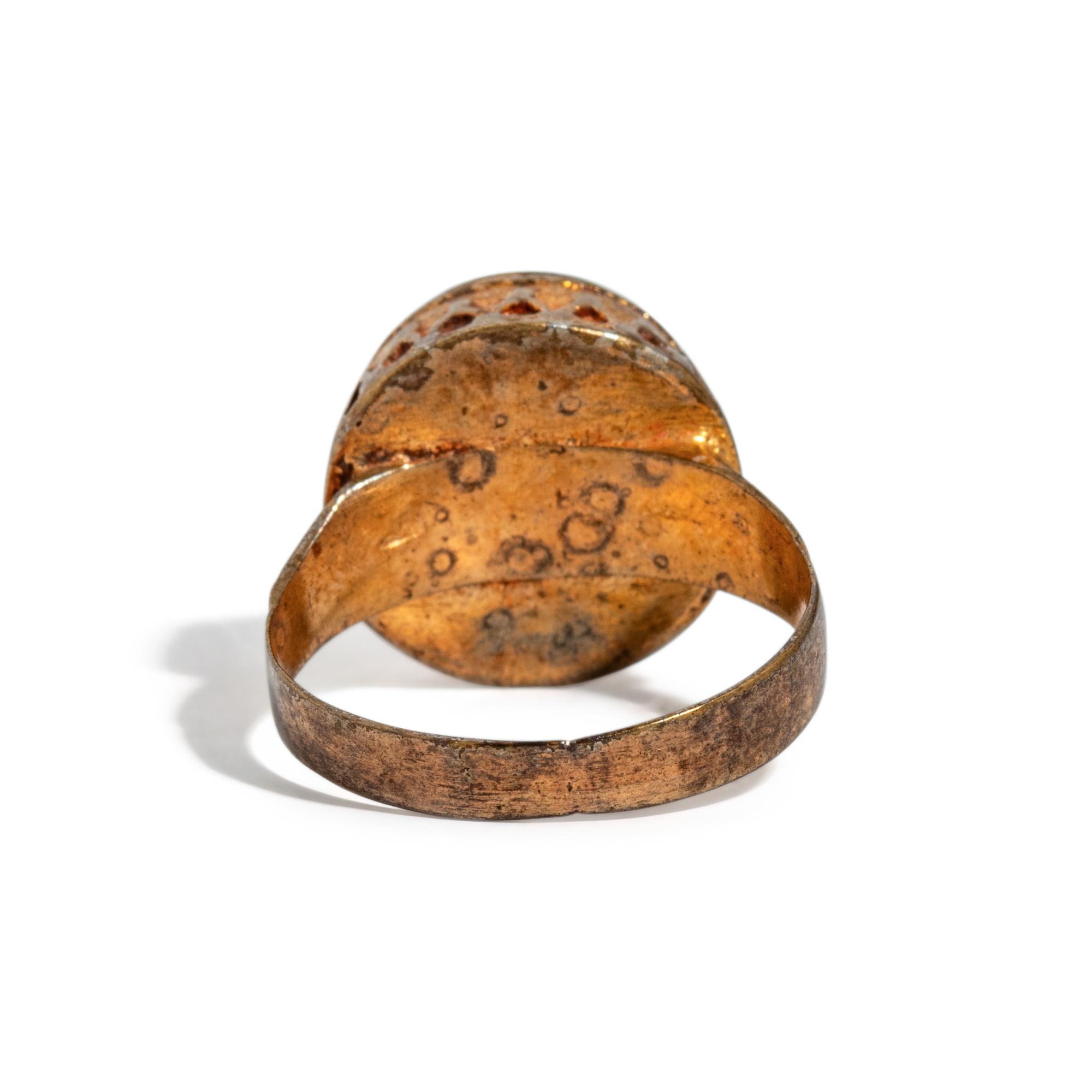 A Near Eastern Banded Agate Cabochon — Set in a gold ring