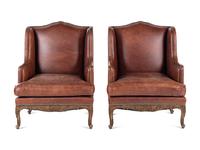 A Pair of Régence Style Leather-Upholstered Wingback Armchairs