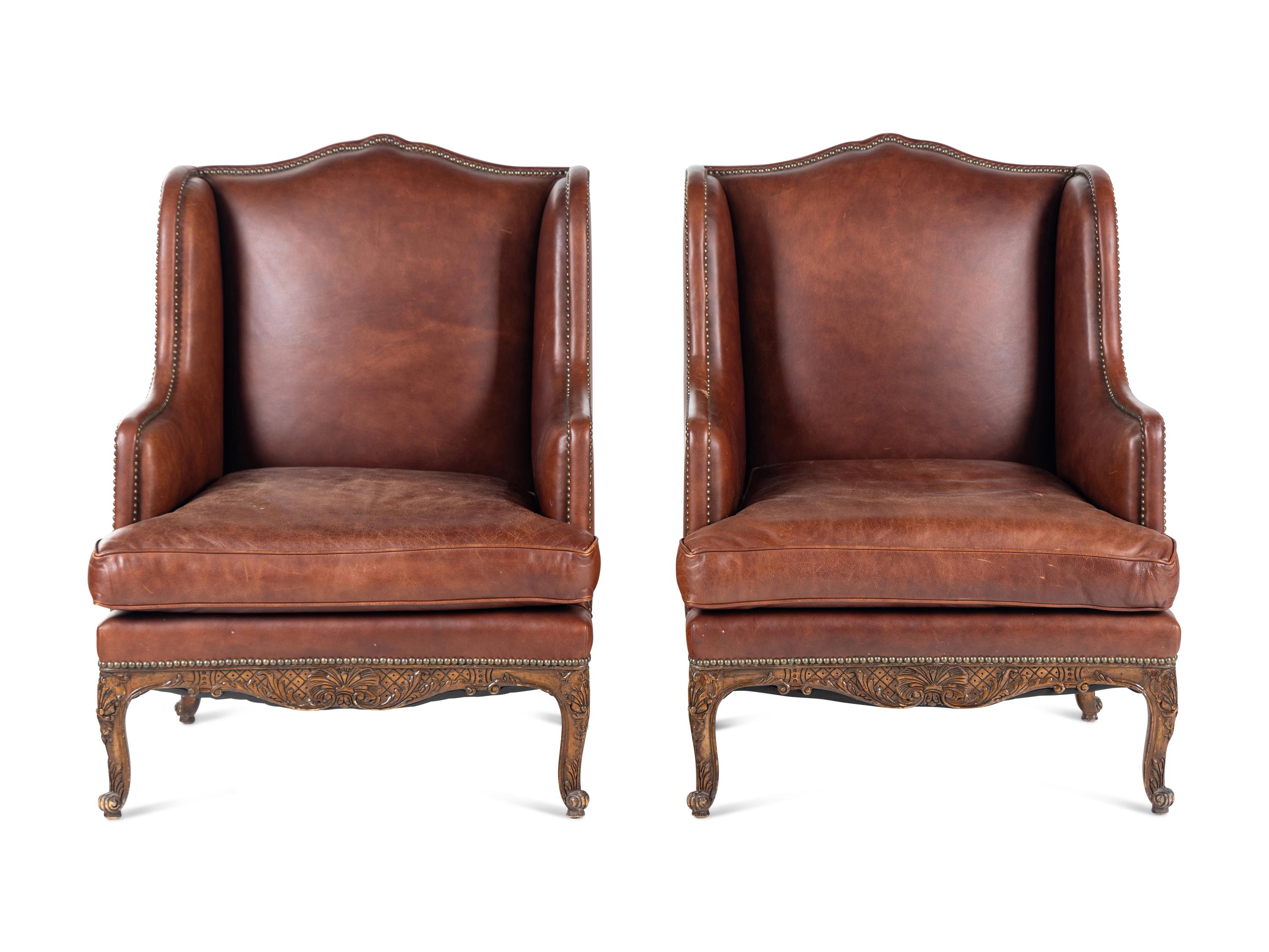 A Pair of Régence Style Leather-Upholstered Wingback Armchairs