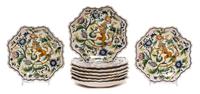 A Set of Nine Quimper Plates Diameter 8 1/4 inches.