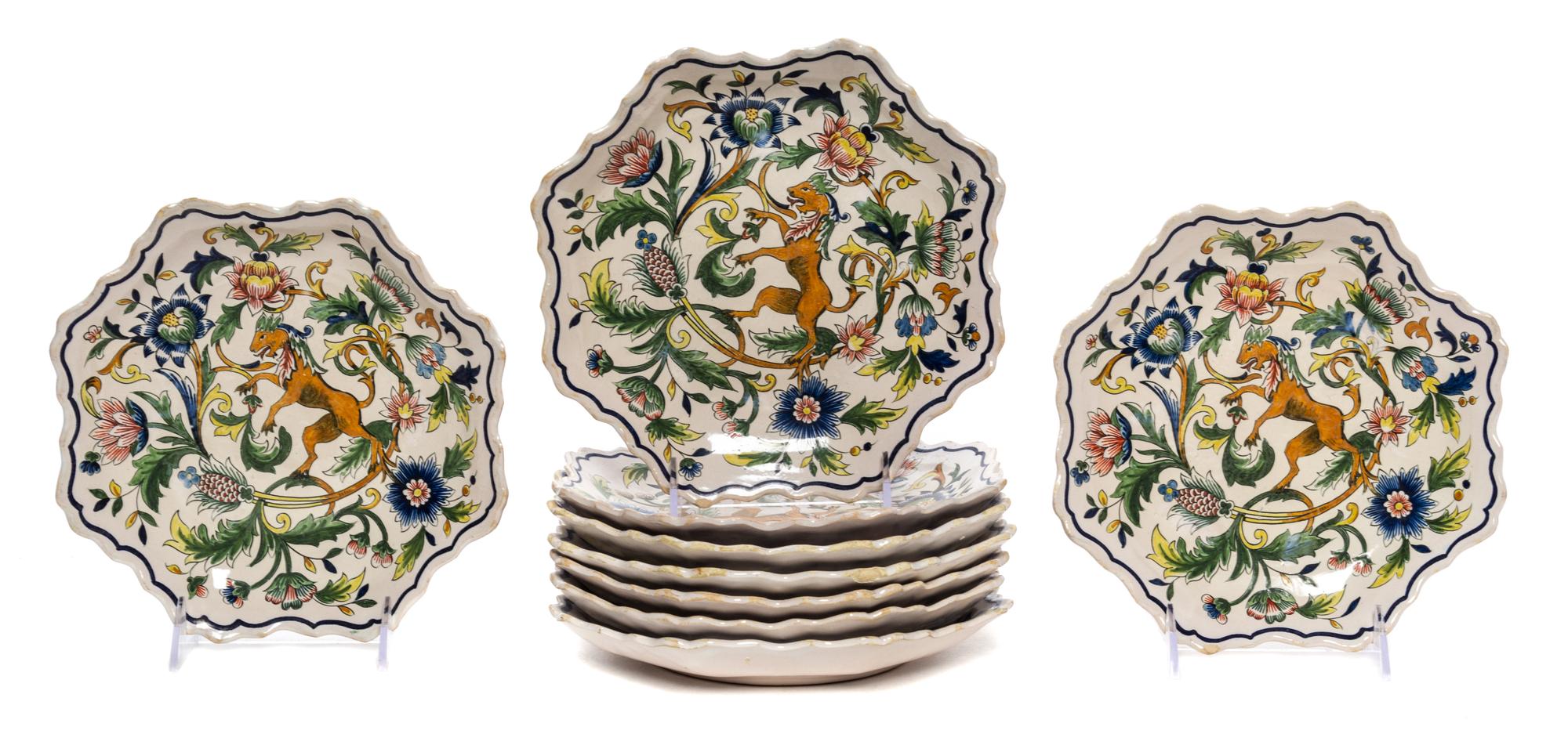 A Set of Nine Quimper Plates Diameter 8 1/4 inches.