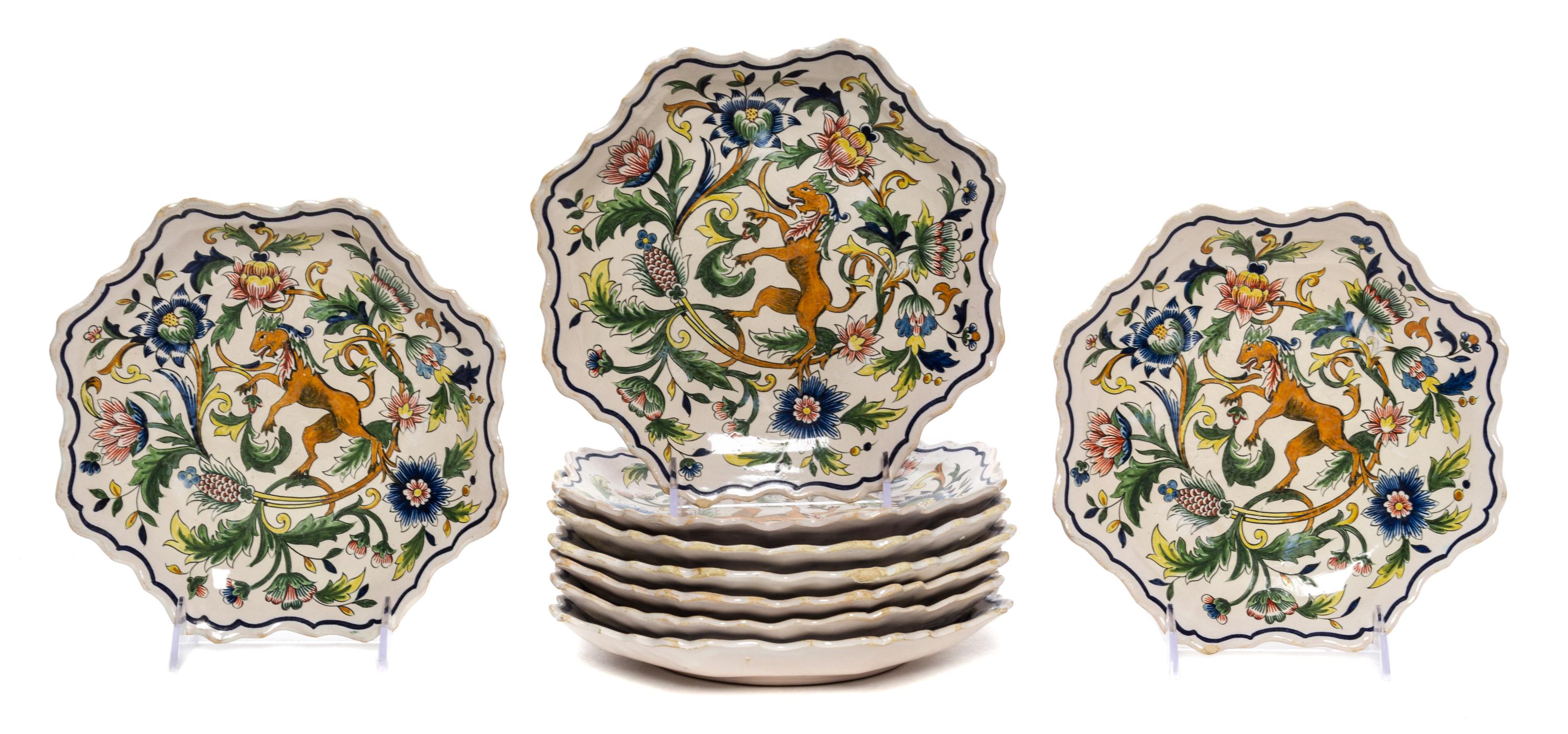 A Set of Nine Quimper Plates Diameter 8 1/4 inches.