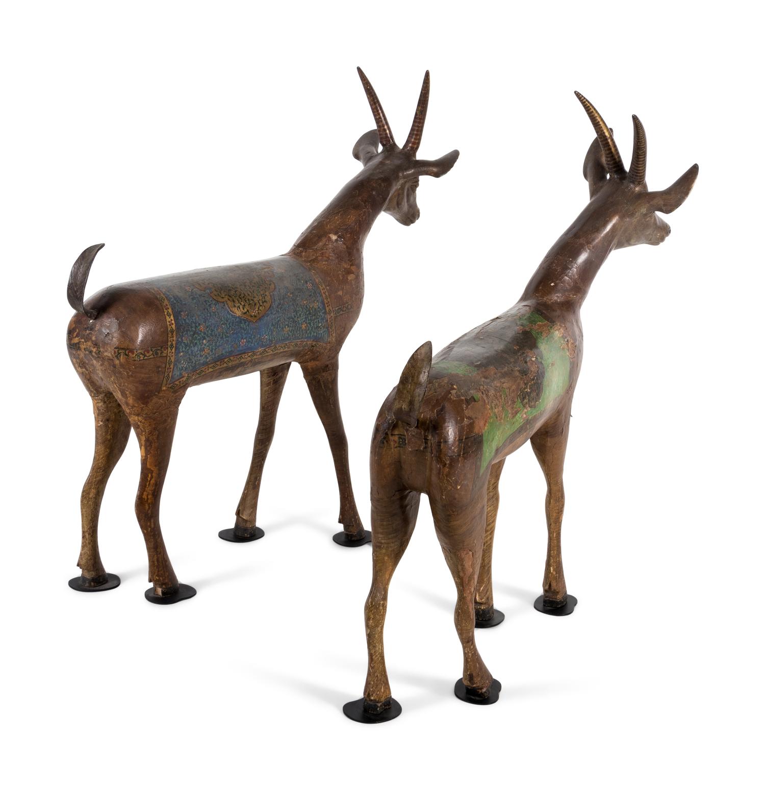 A Pair of Indian Painted Wood Models of Deer