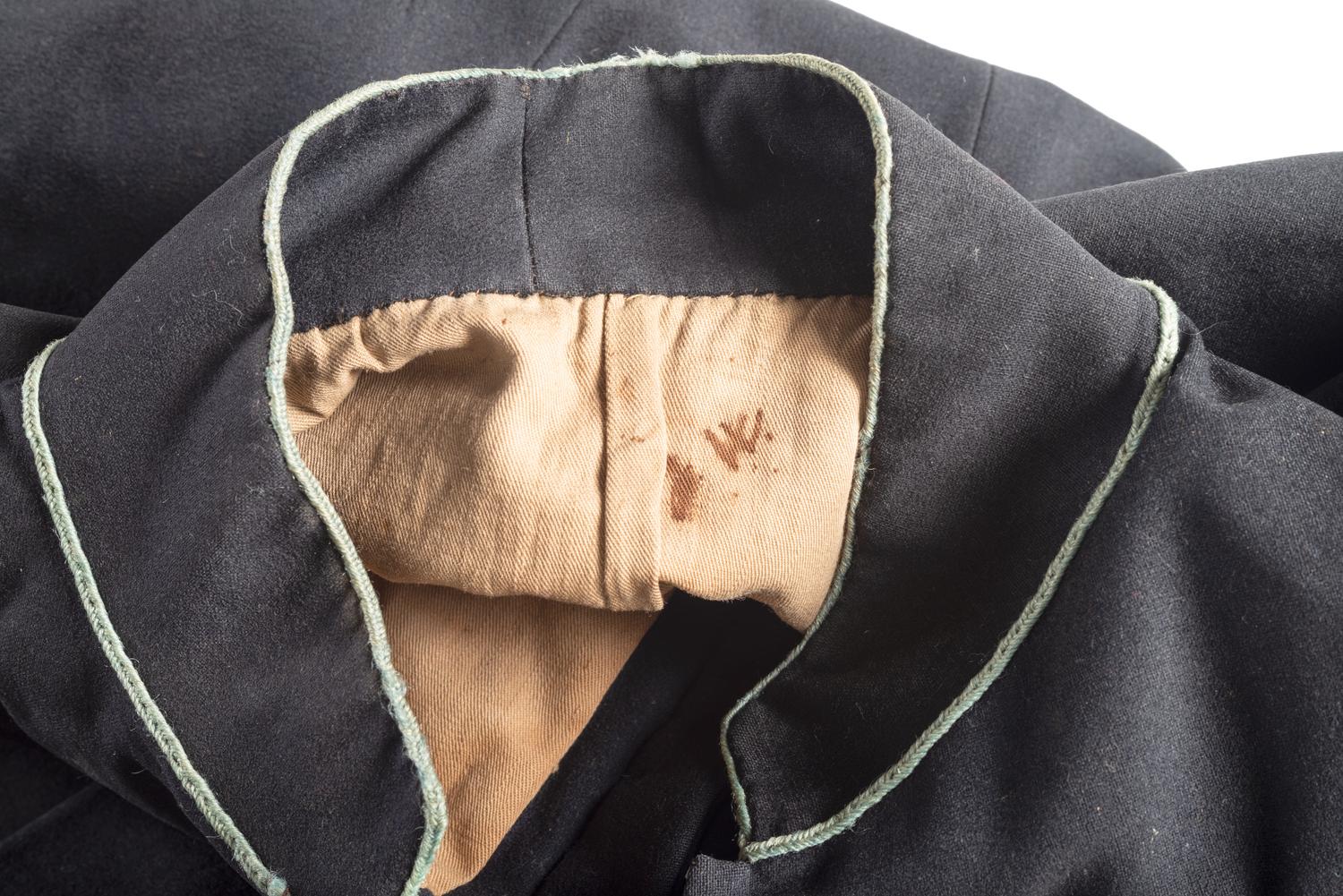 Civil War regulation Model 1858 infantry frock coat identified to Private James C. Woods, Company E, 5th Ohio Infantry.