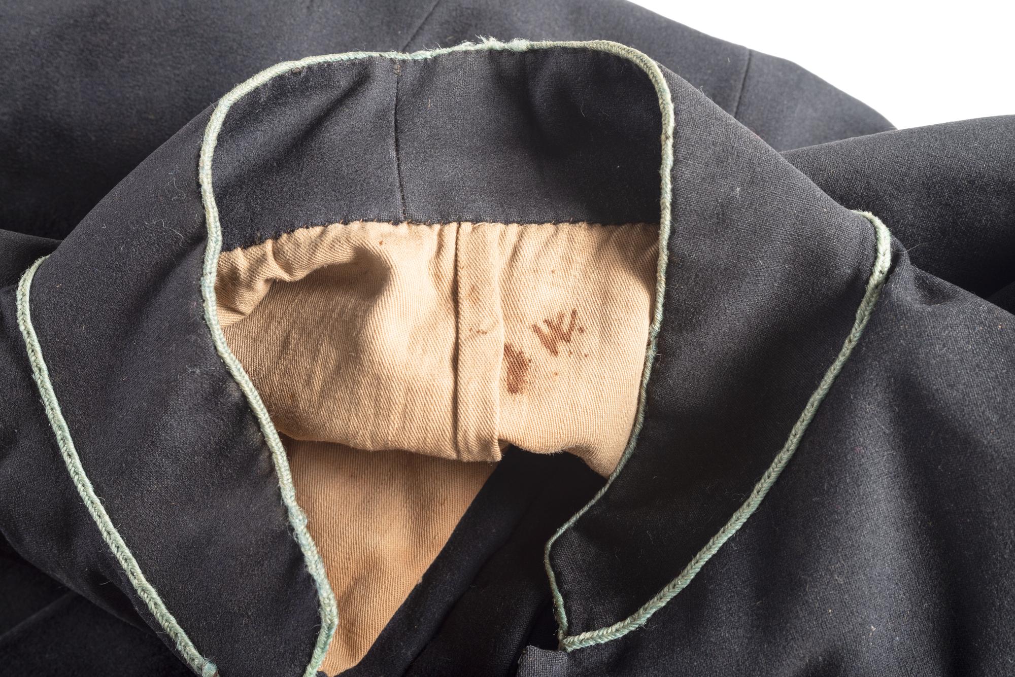 Civil War regulation Model 1858 infantry frock coat identified to Private James C. Woods, Company E, 5th Ohio Infantry.
